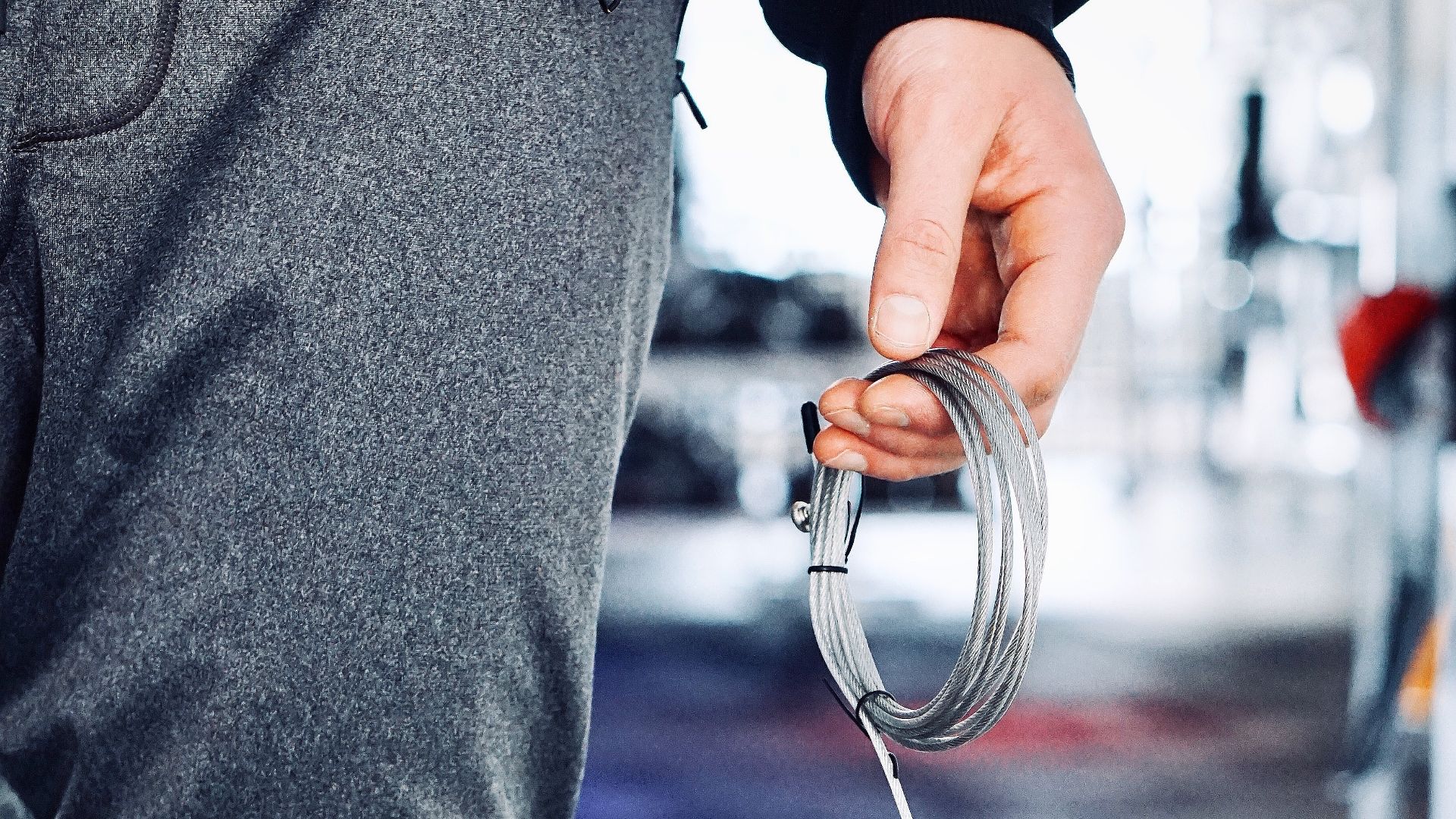 person holding gray wire