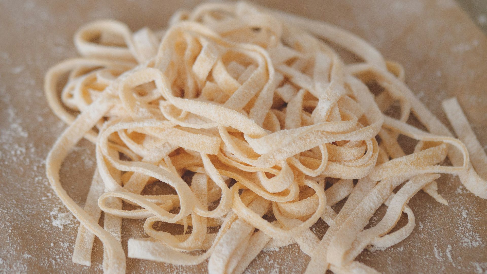white pasta on brown wooden table