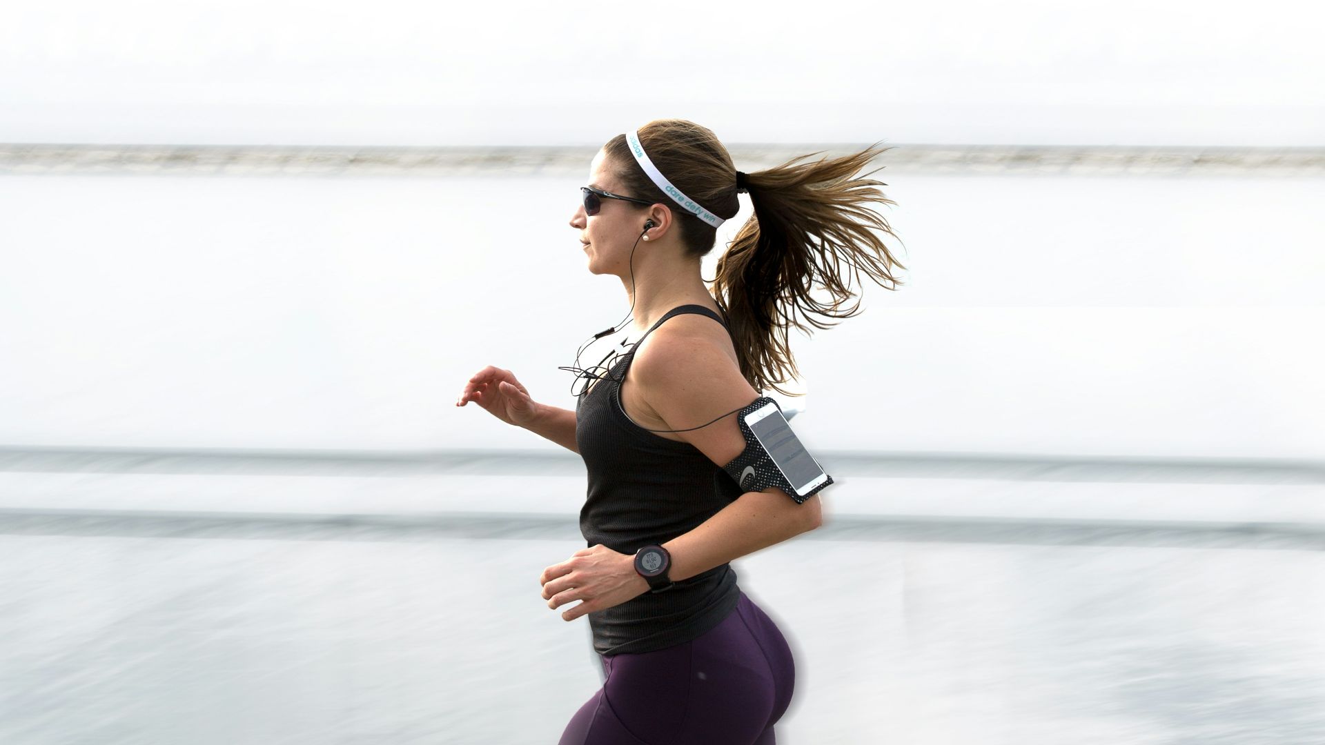 woman running wearing armband