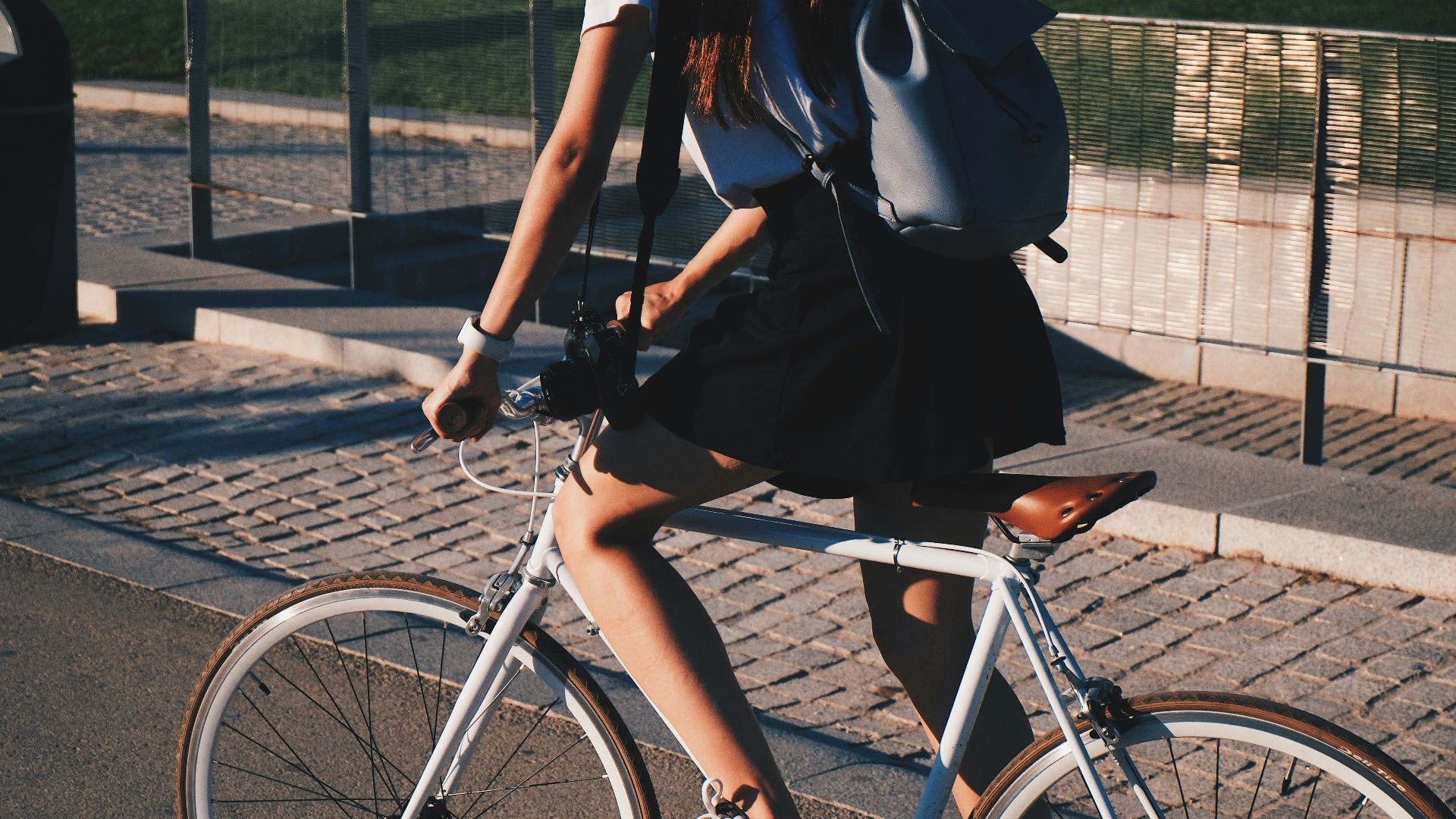 woman riding white rigid bike