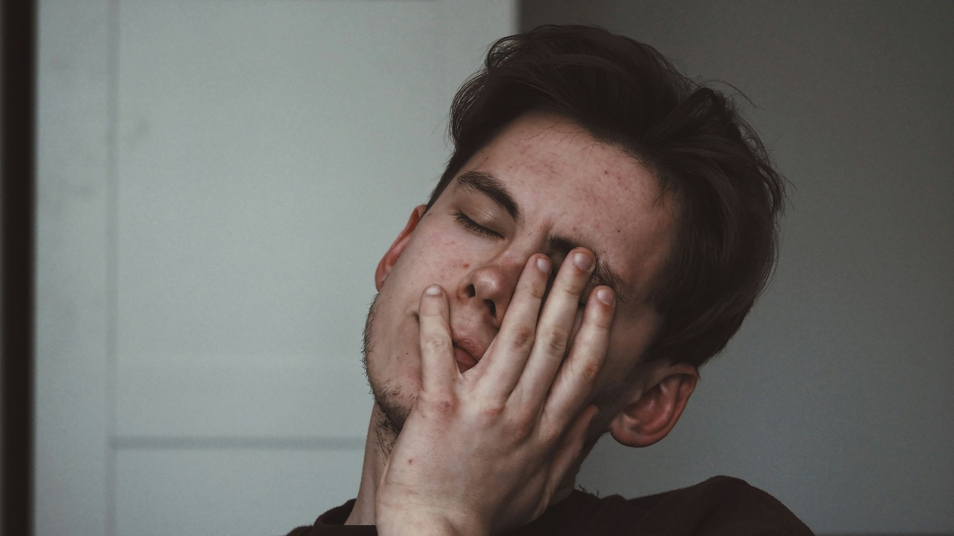 man wearing black crew-neck top