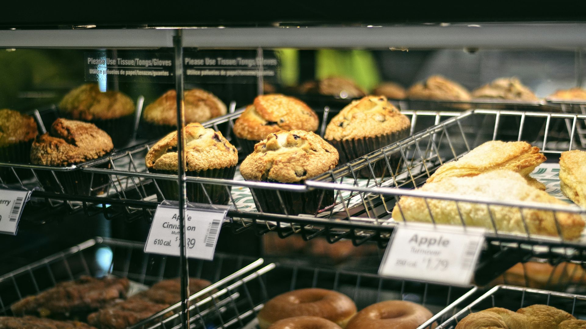 a display case filled with lots of different types of doughnuts