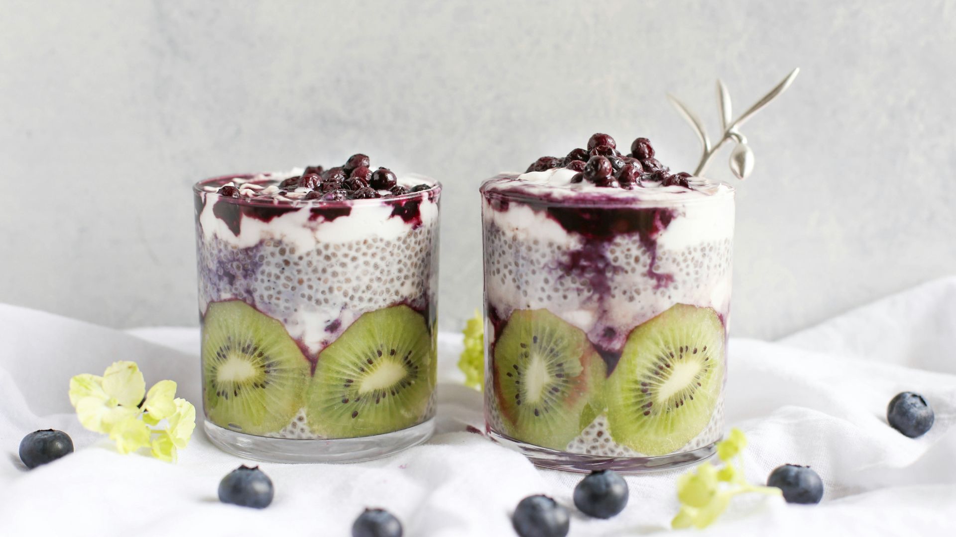 two fruit beverages on glass cups