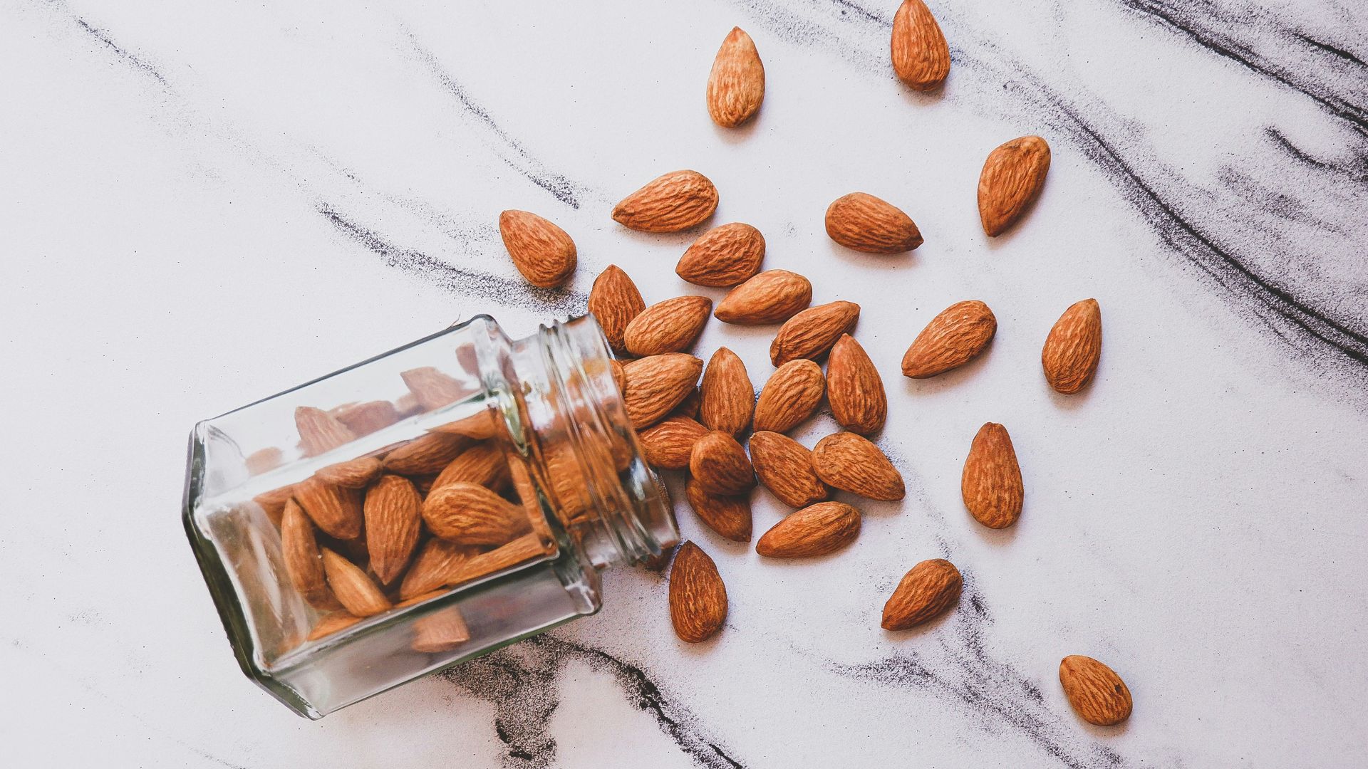 brown almond on white table