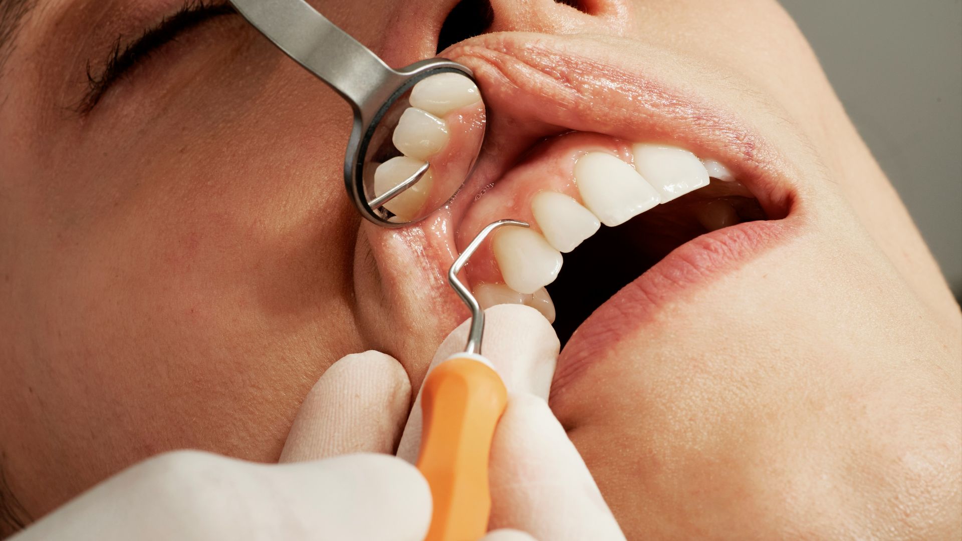 woman with silver and yellow hoop earrings