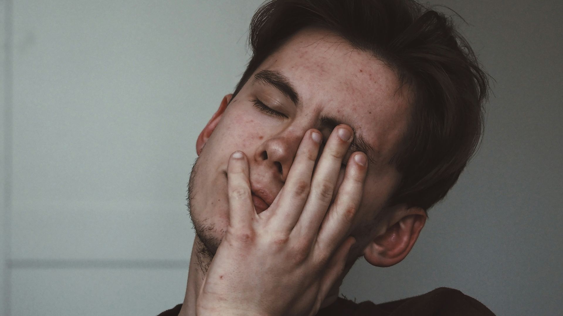 man wearing black crew-neck top