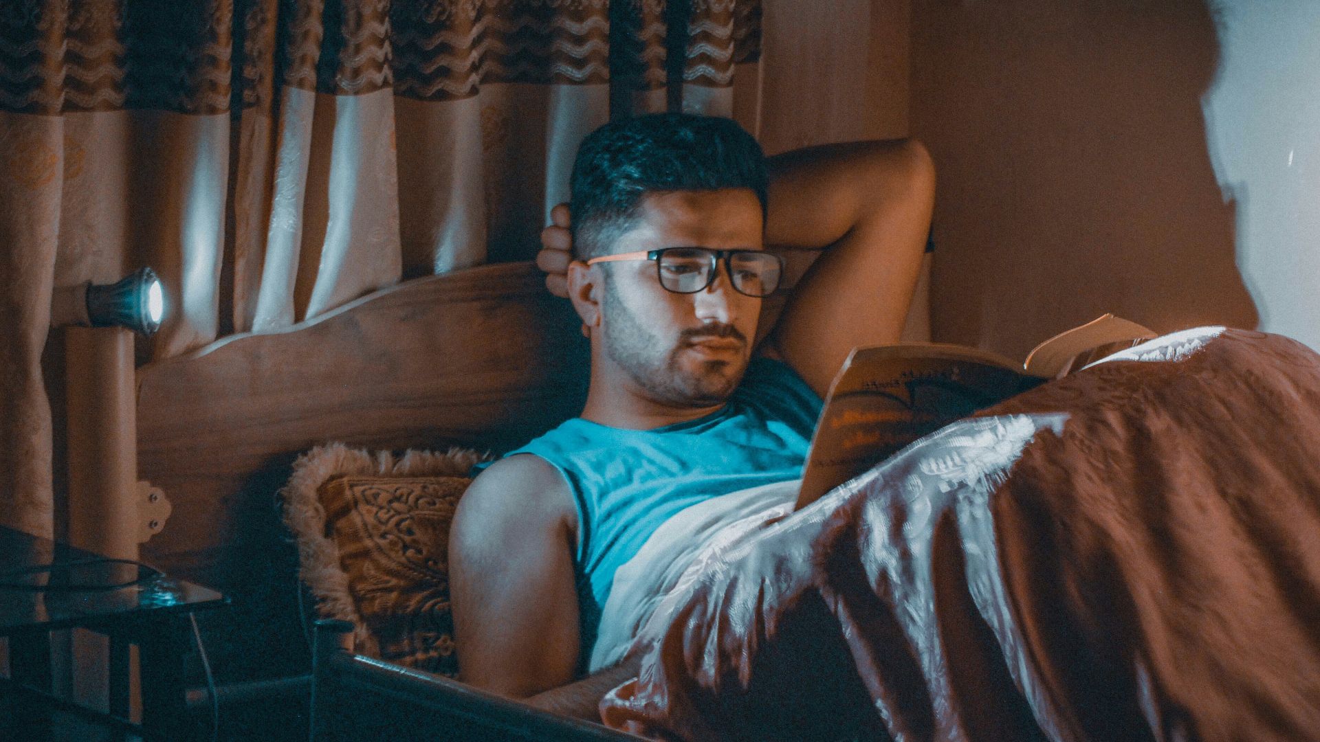 a man sitting in a chair with a laptop