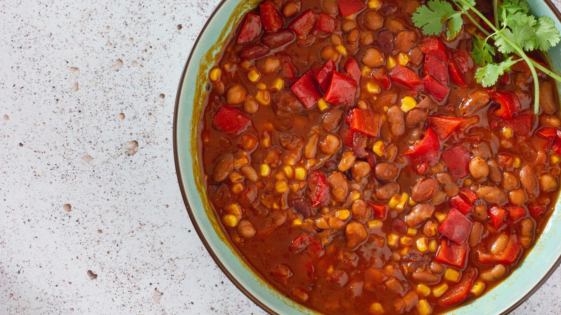 red and green chili peppers in white ceramic bowl