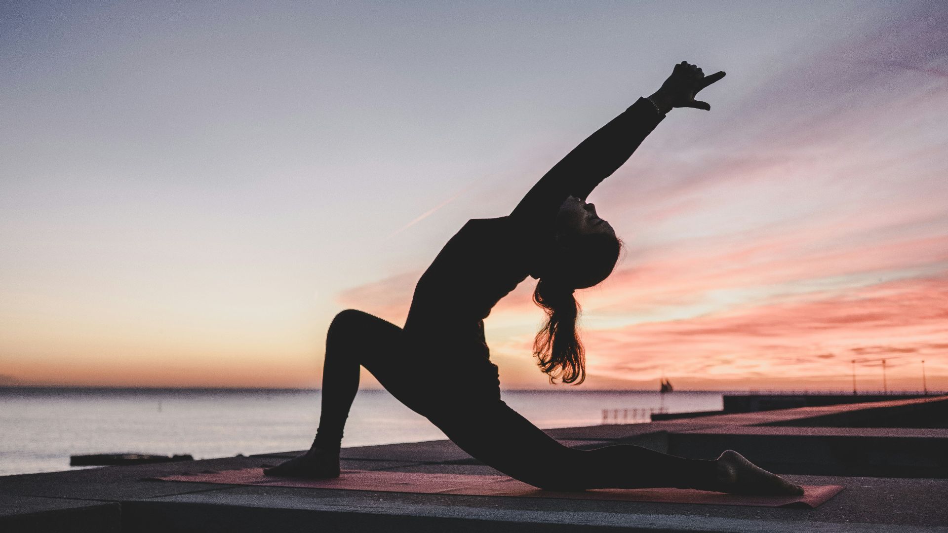 silhouette photography of woman doing yoga