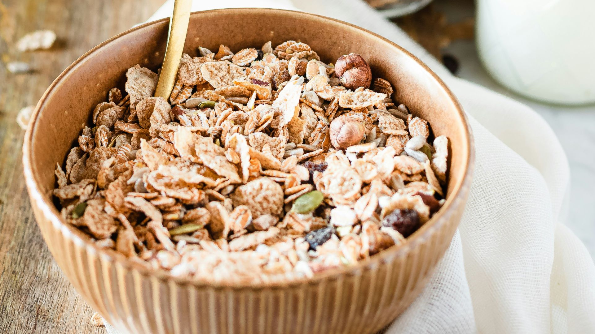 brown wooden bowl with brown wooden spoon
