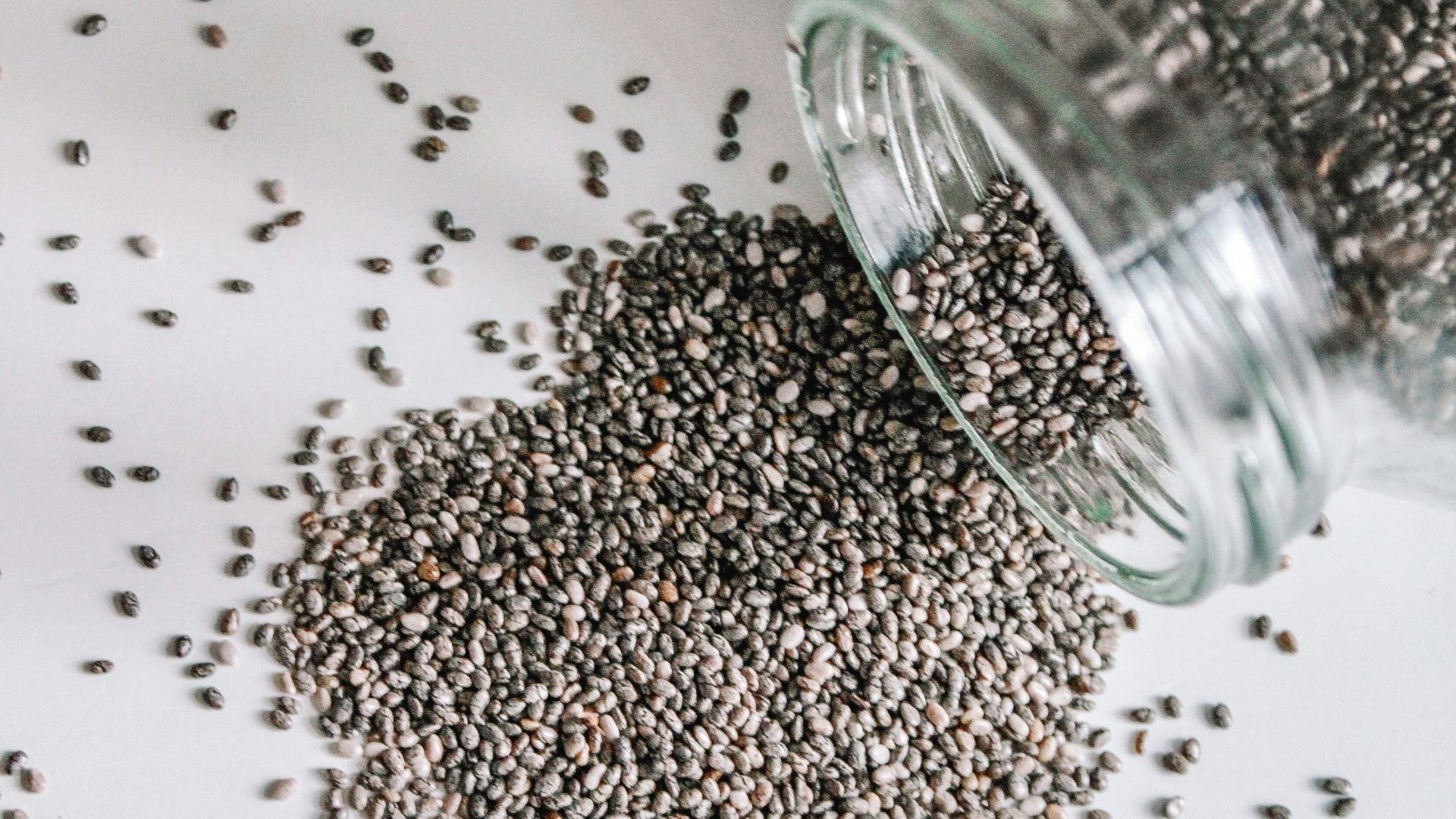 black beads in clear glass jar