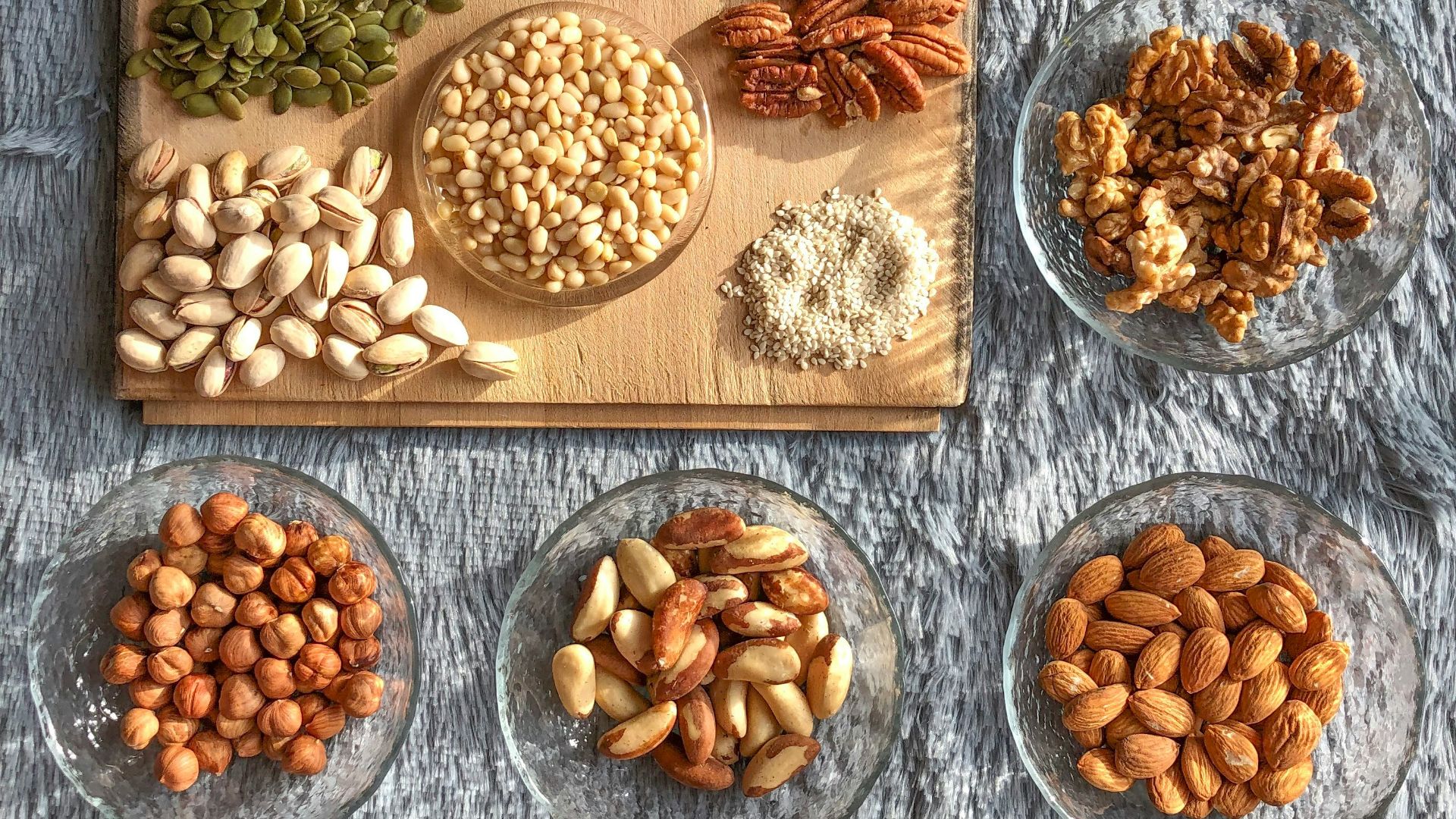 brown and white nuts on white ceramic bowls