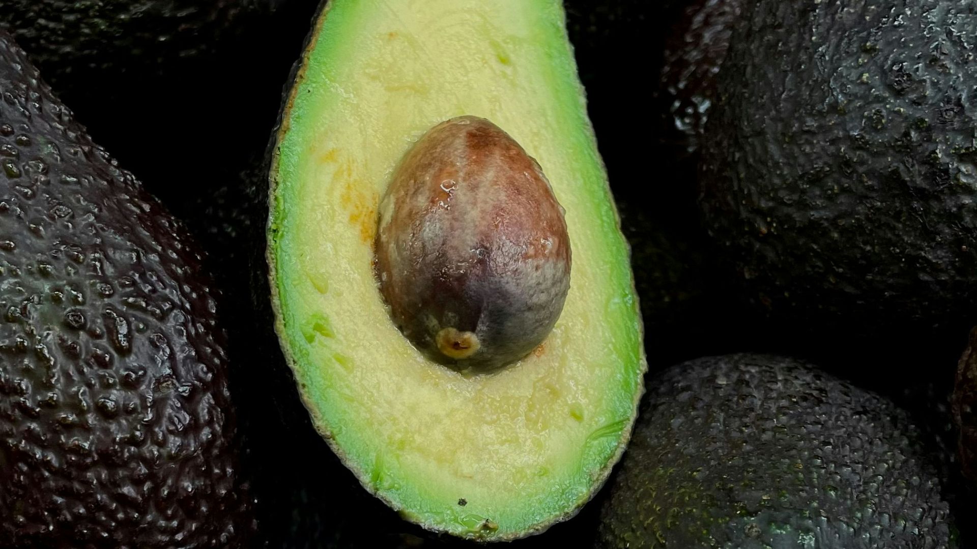 green and brown fruit on black and brown fruits