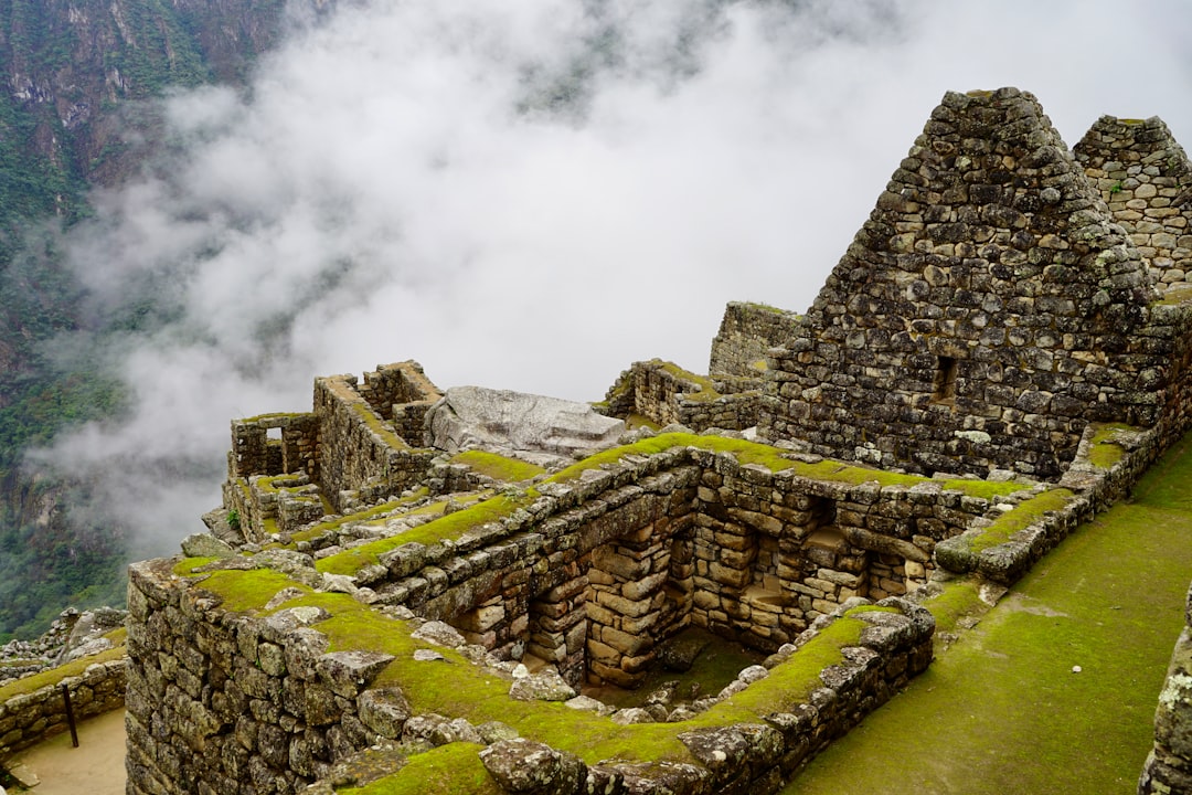 a stone structure with moss growing on top of it