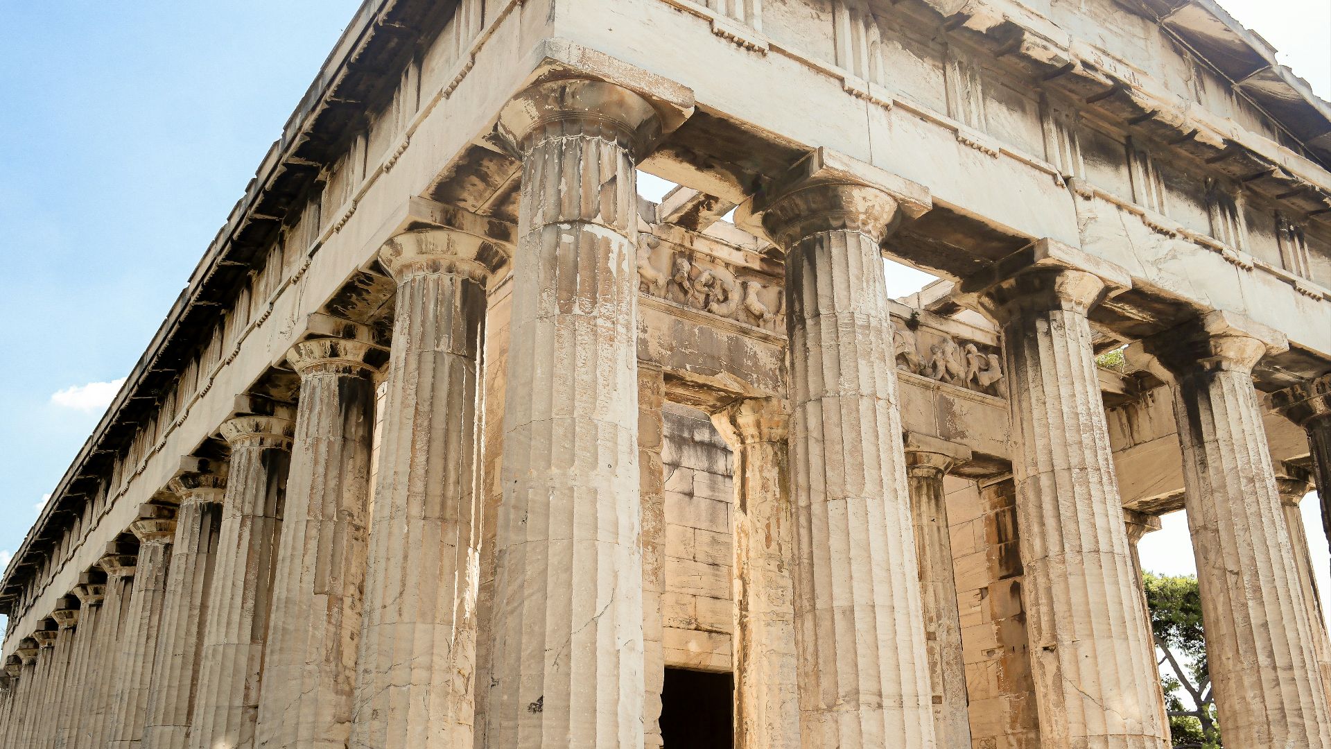 a very tall building with some columns on it