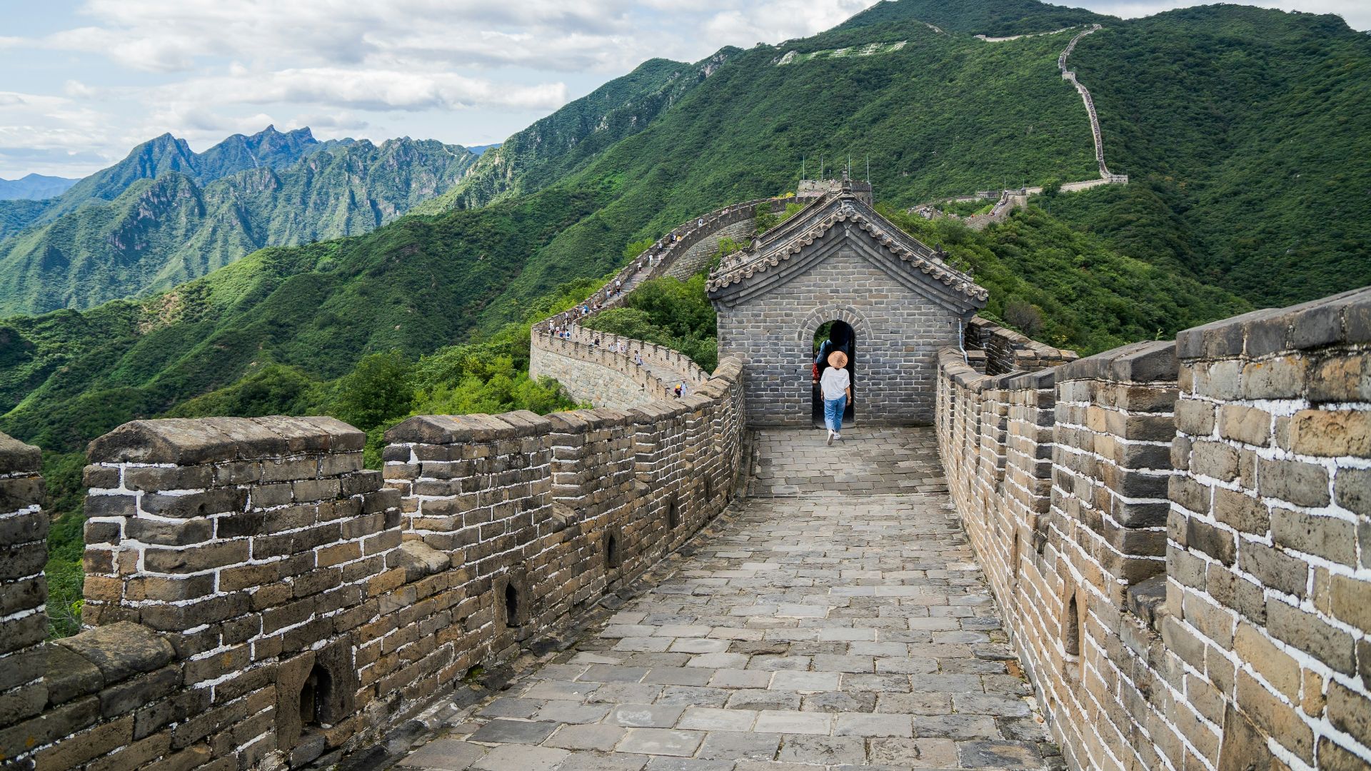 woman walking on great wall of China during daytime