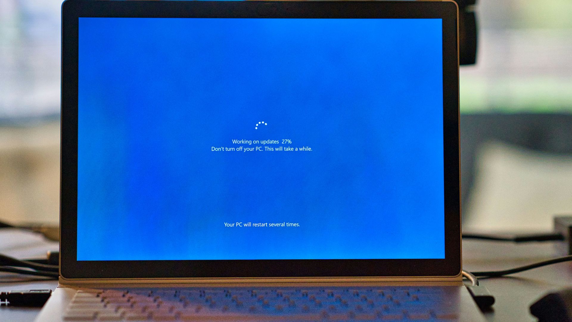 macbook pro on brown wooden table