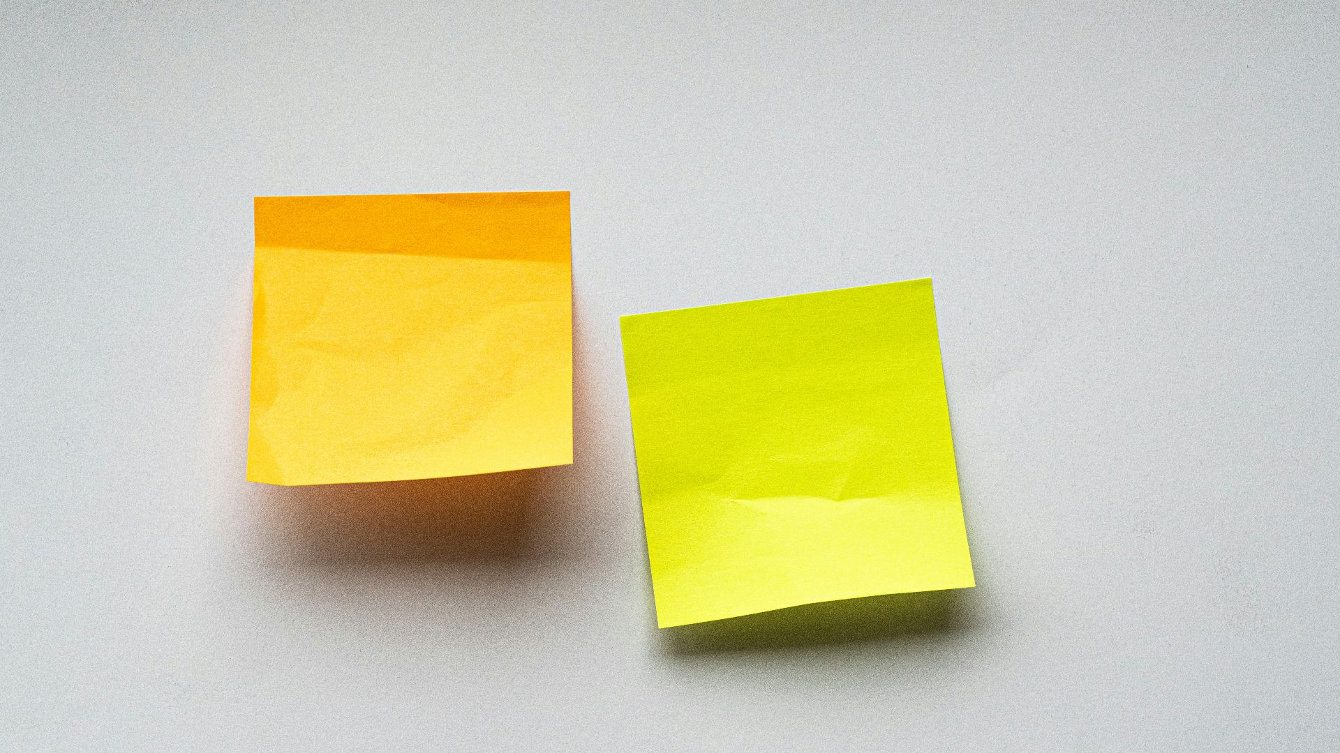 yellow sticky notes on white wall