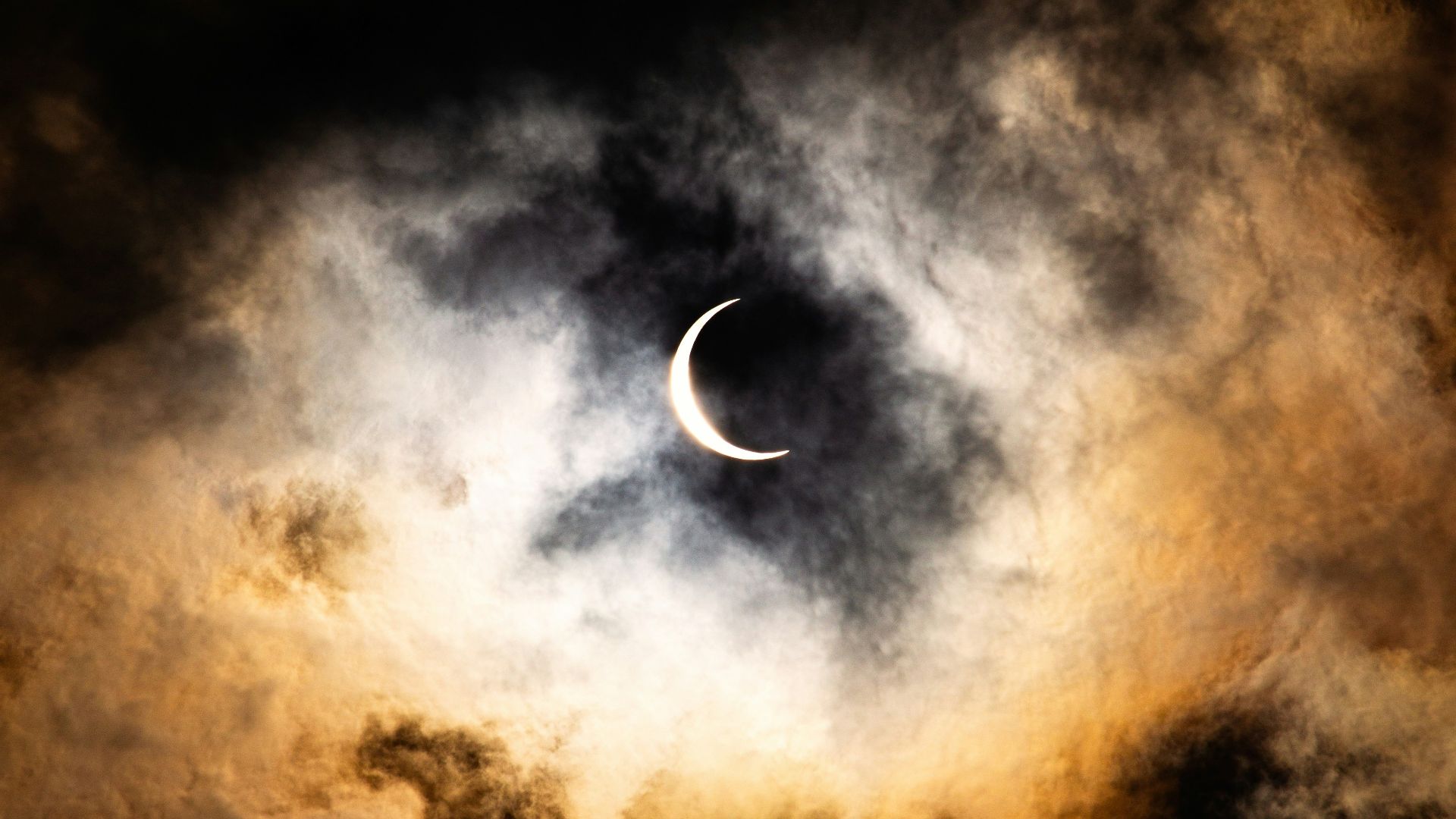 full moon covered by clouds