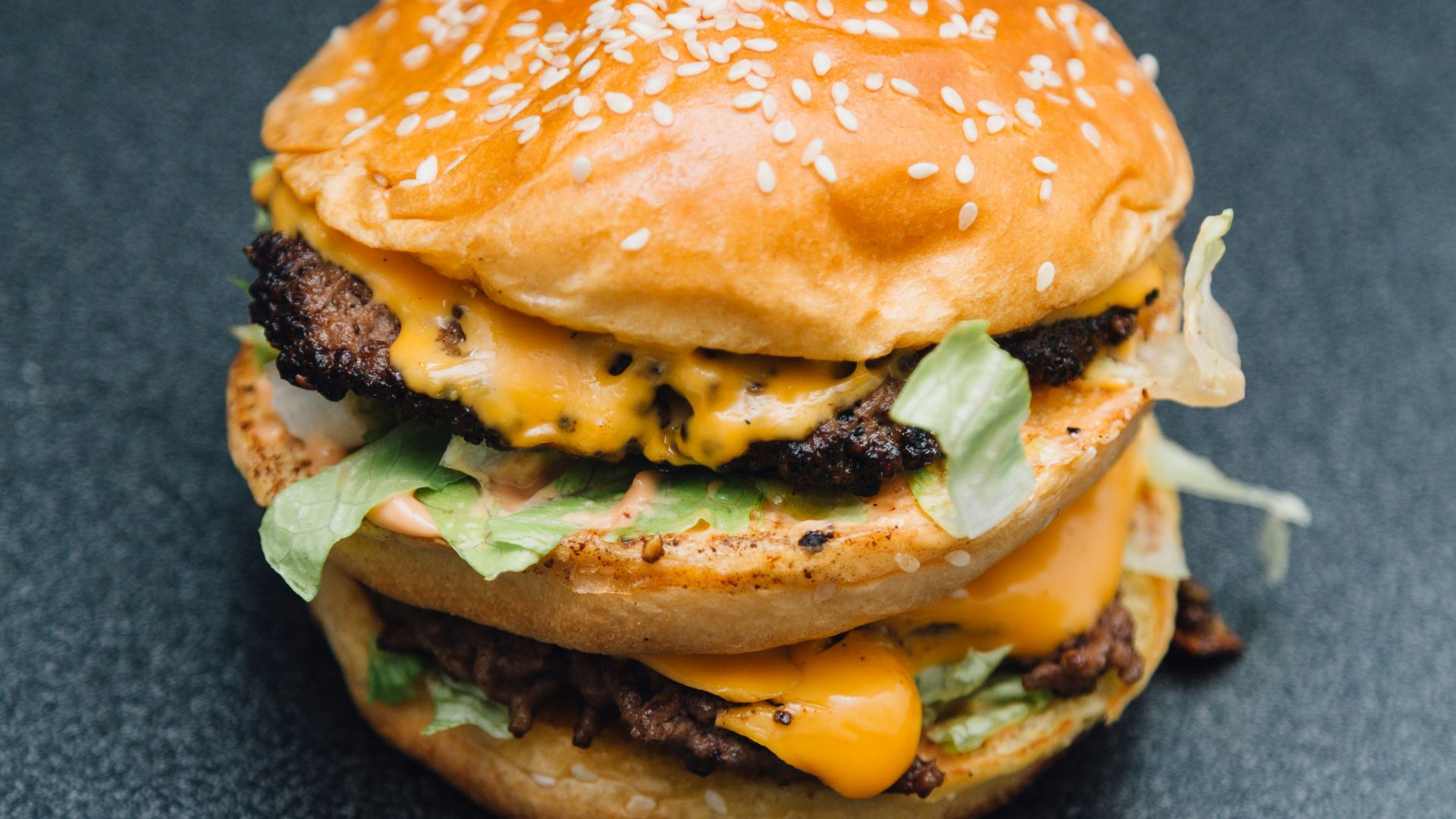 A hamburger sitting on top of a table