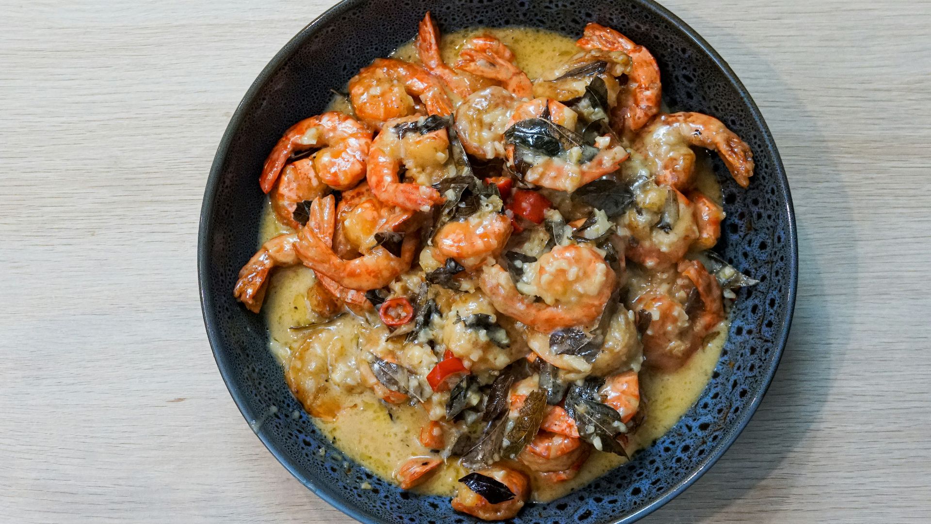 a bowl of food that is on a table