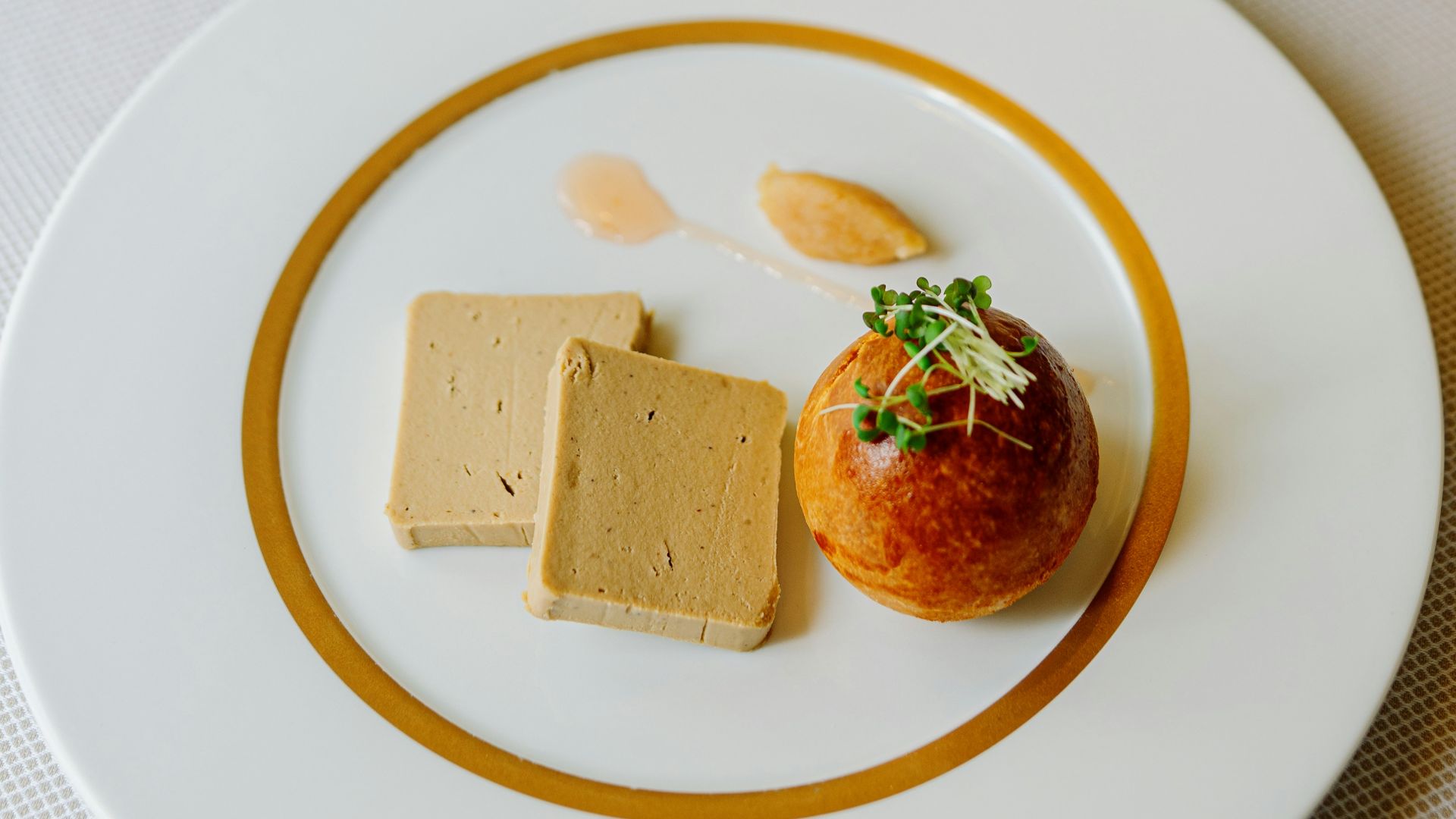 a white plate topped with food on top of a table