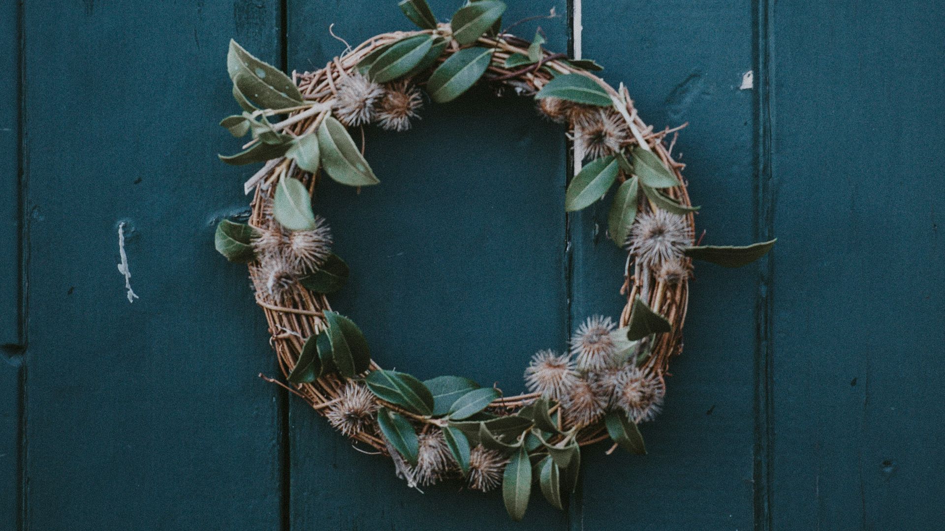 brown and green wreath hanging on wall