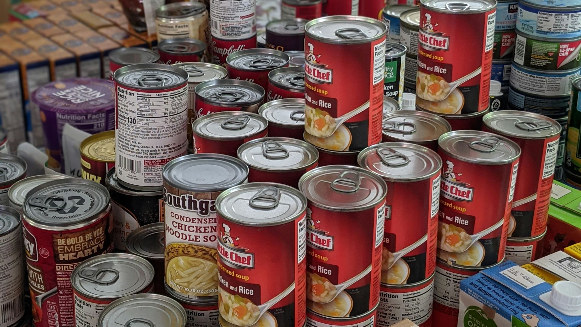 red and white labeled cans