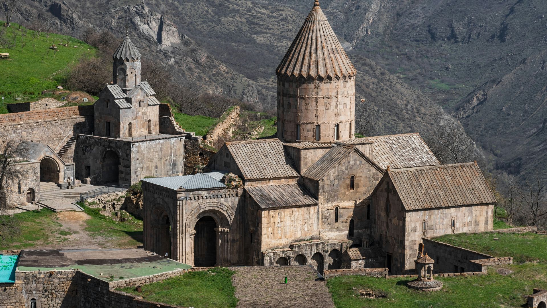 an old church with a steeple in the background