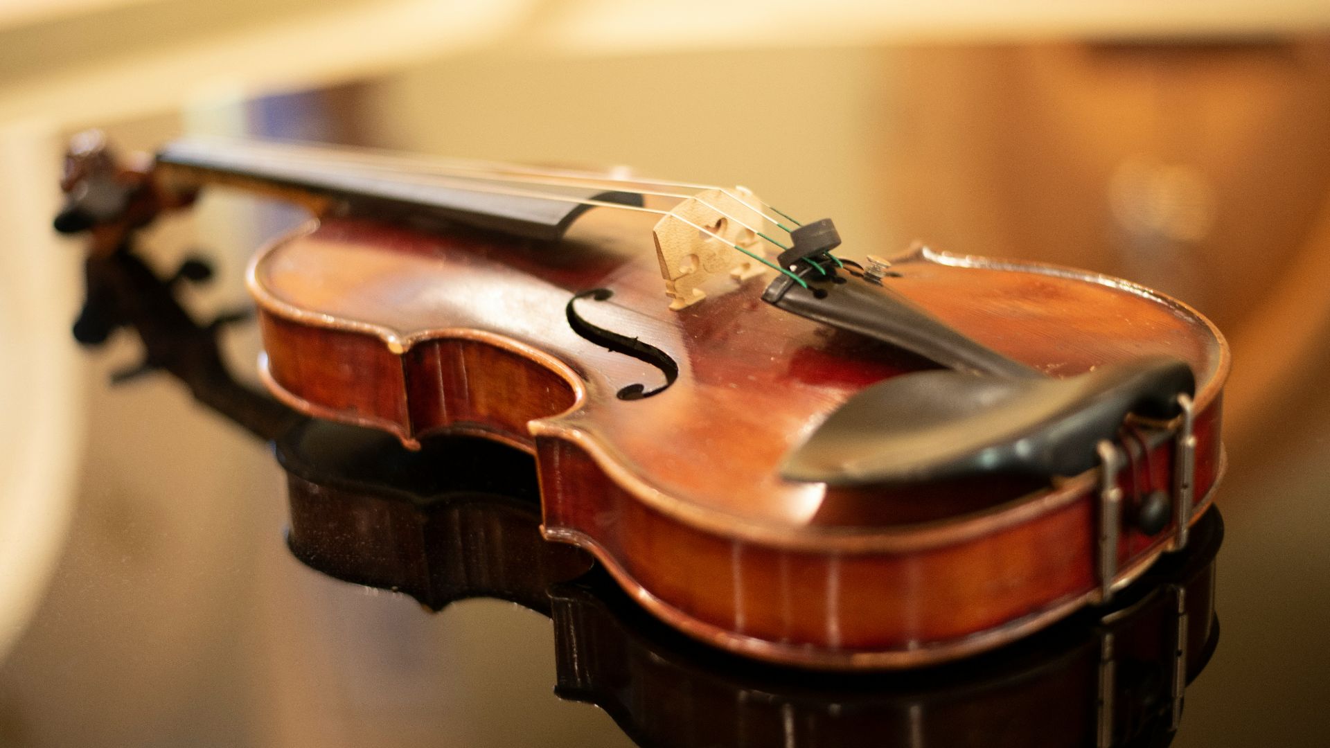 a close up of a violin on a table