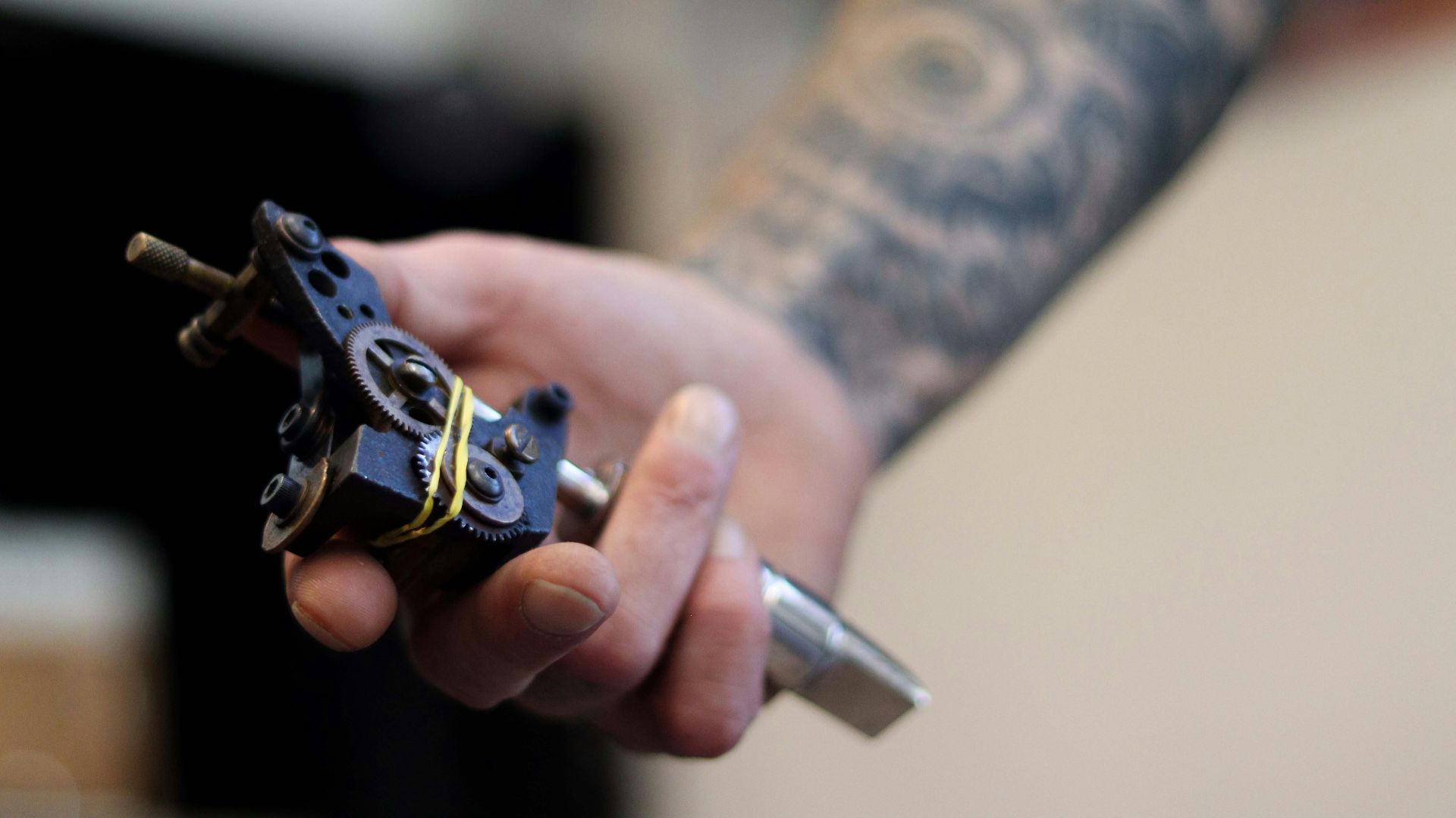 person holding silver and gold key