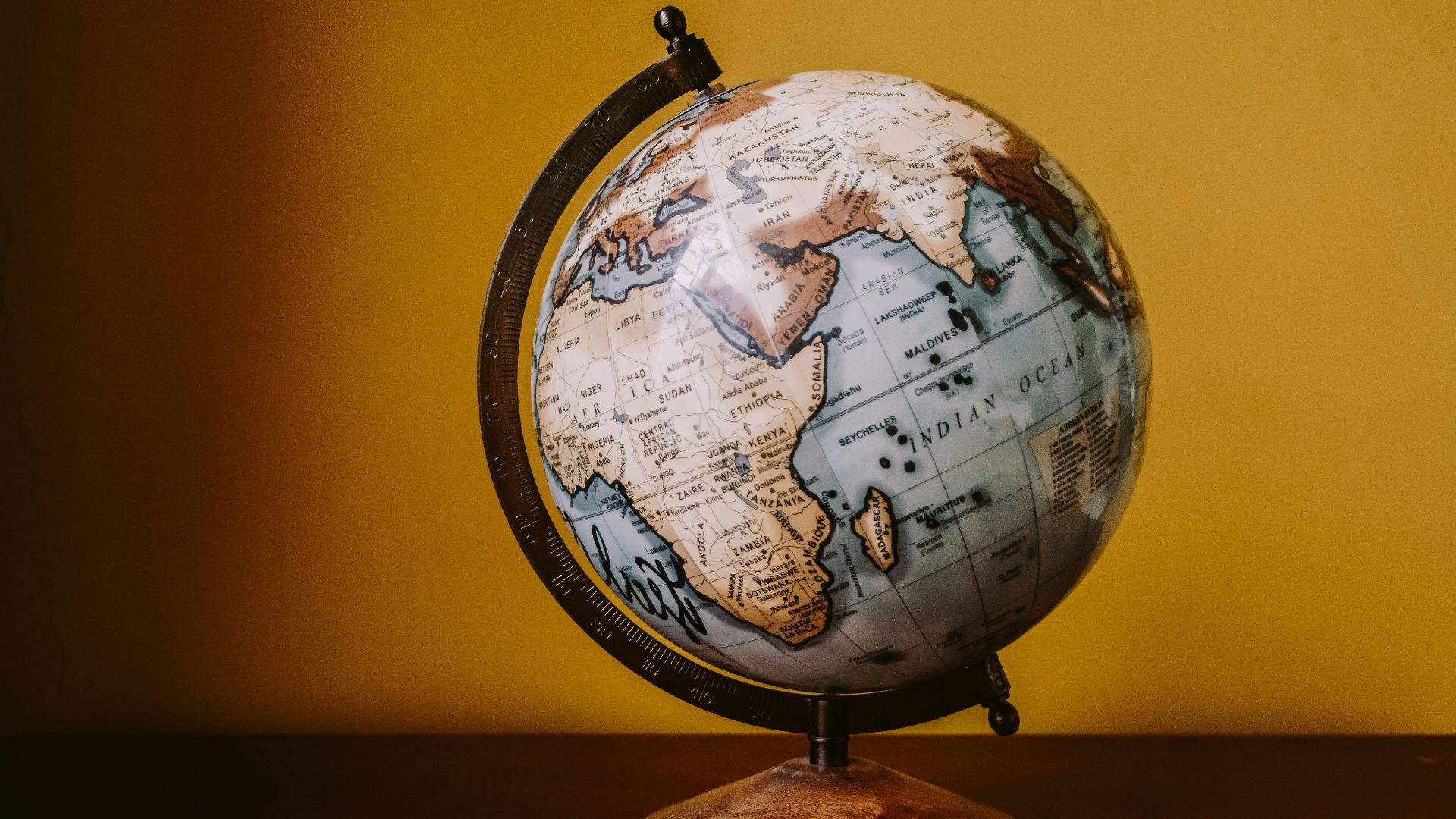 white and brown desk globe