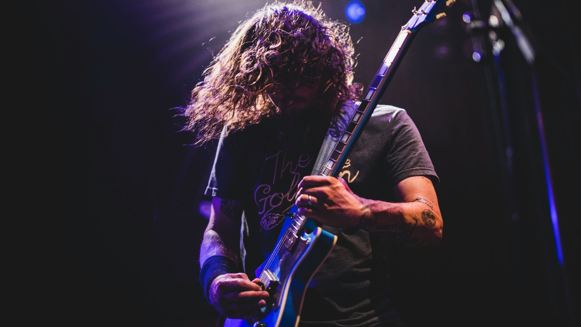 man playing electric guitar