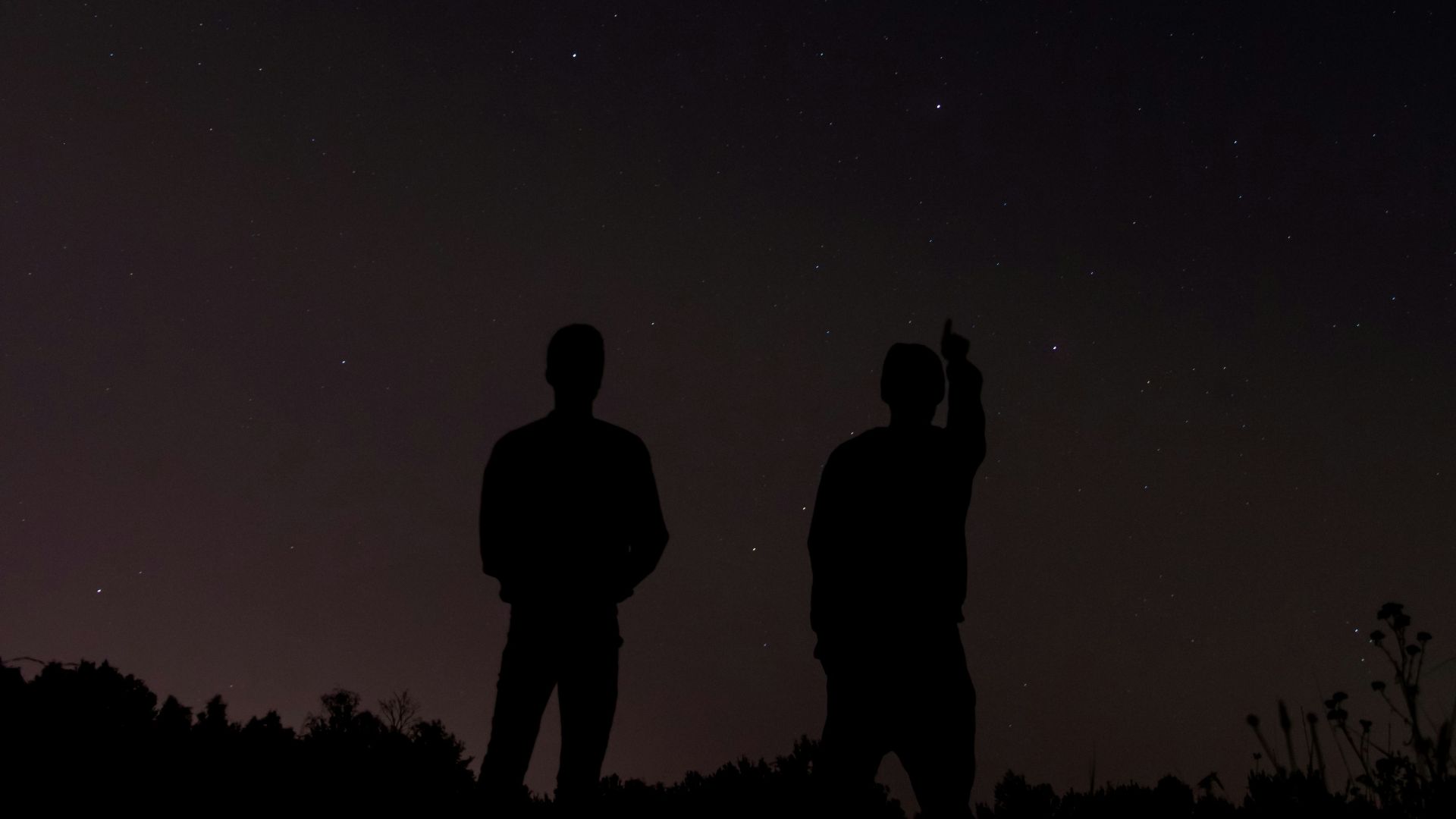 silhouette photography of two people during daytime