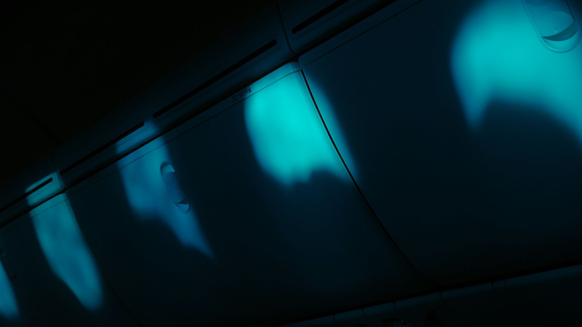 Abstract blue lights on dark ceiling