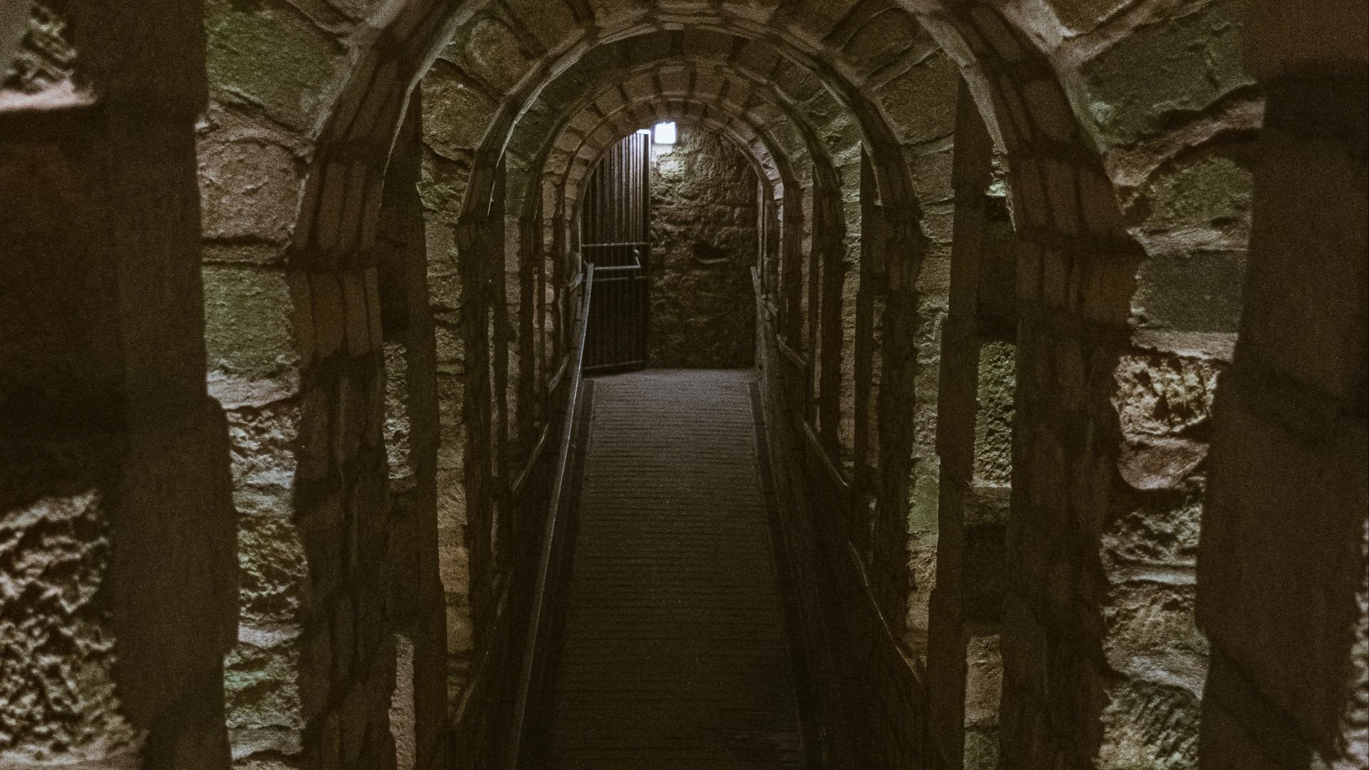 a long tunnel with a light at the end