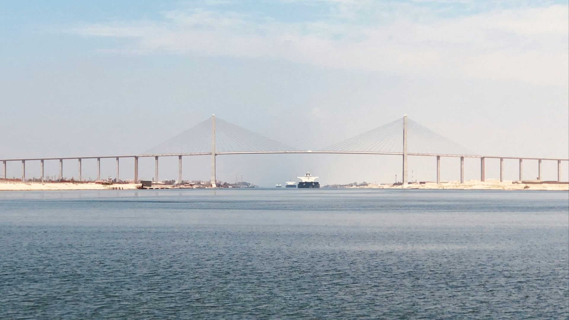 bridge over the sea under blue sky during daytime