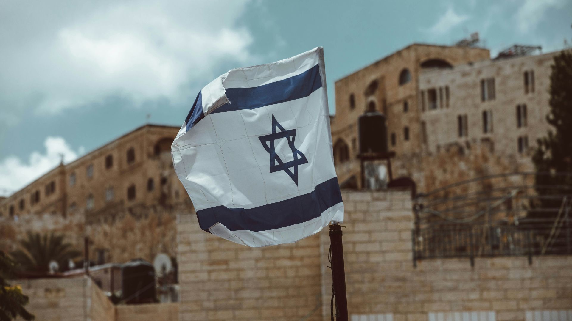 blue and white flag on pole