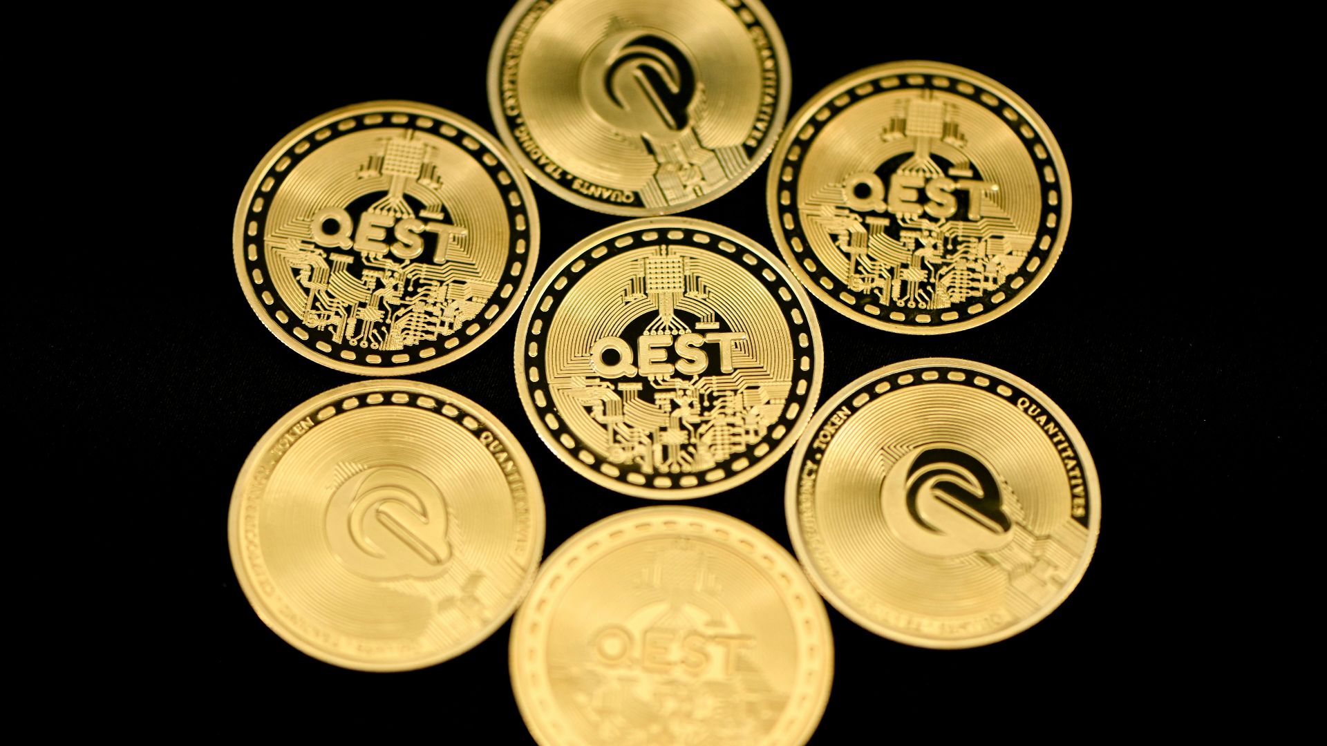 a group of five gold coins sitting on top of each other