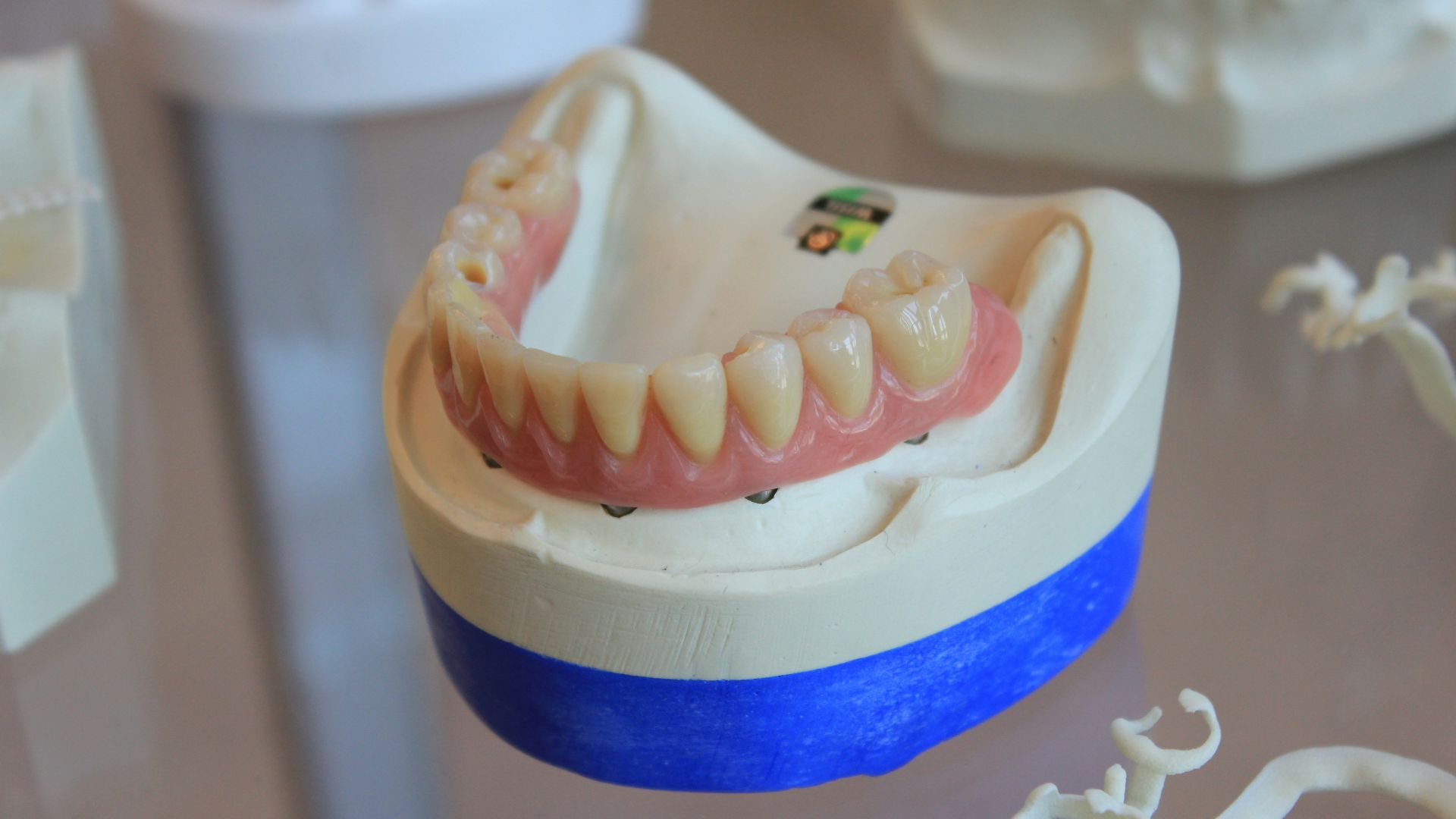 dentures on white scale rack