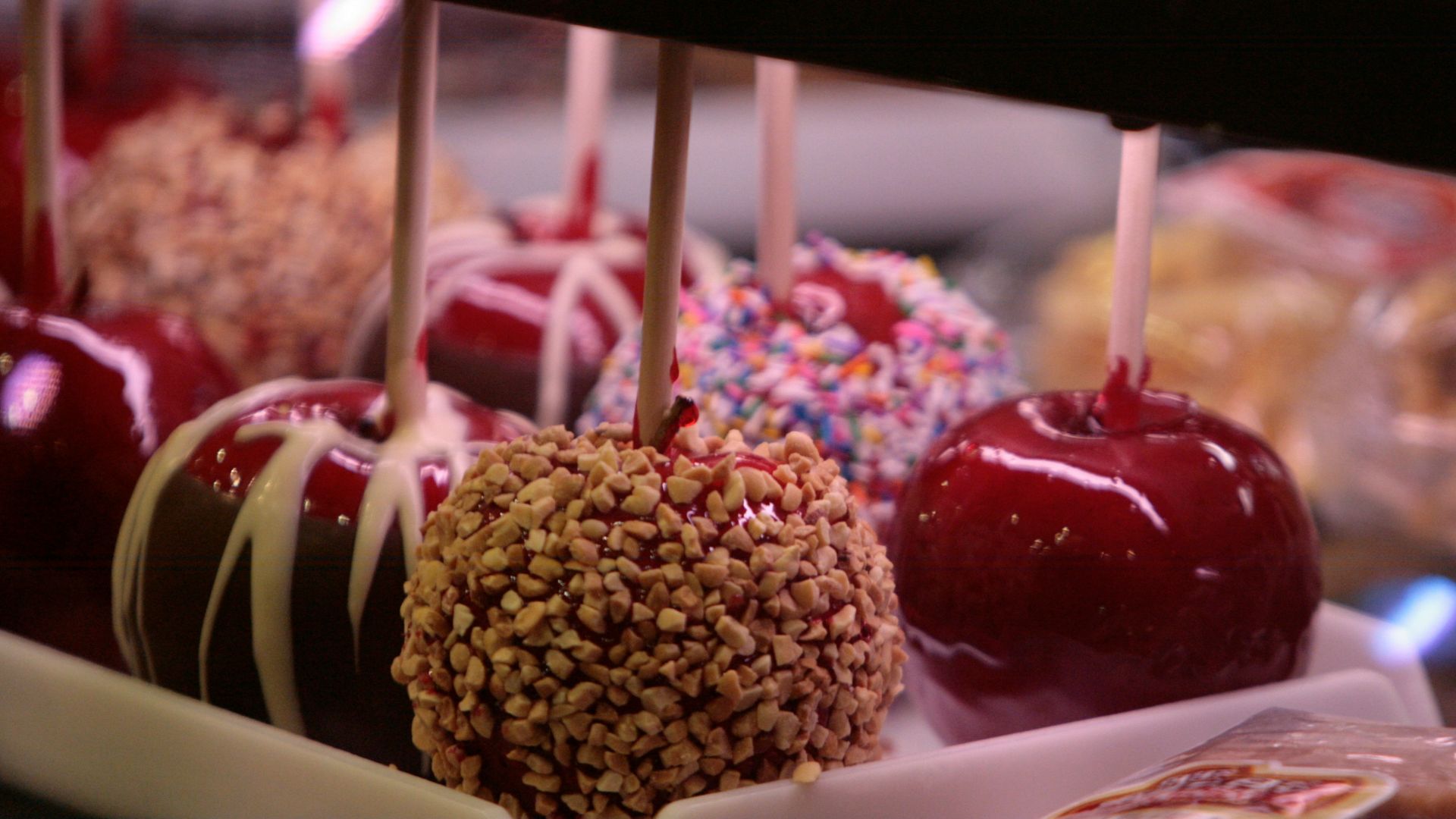 a group of fruits with sticks in them