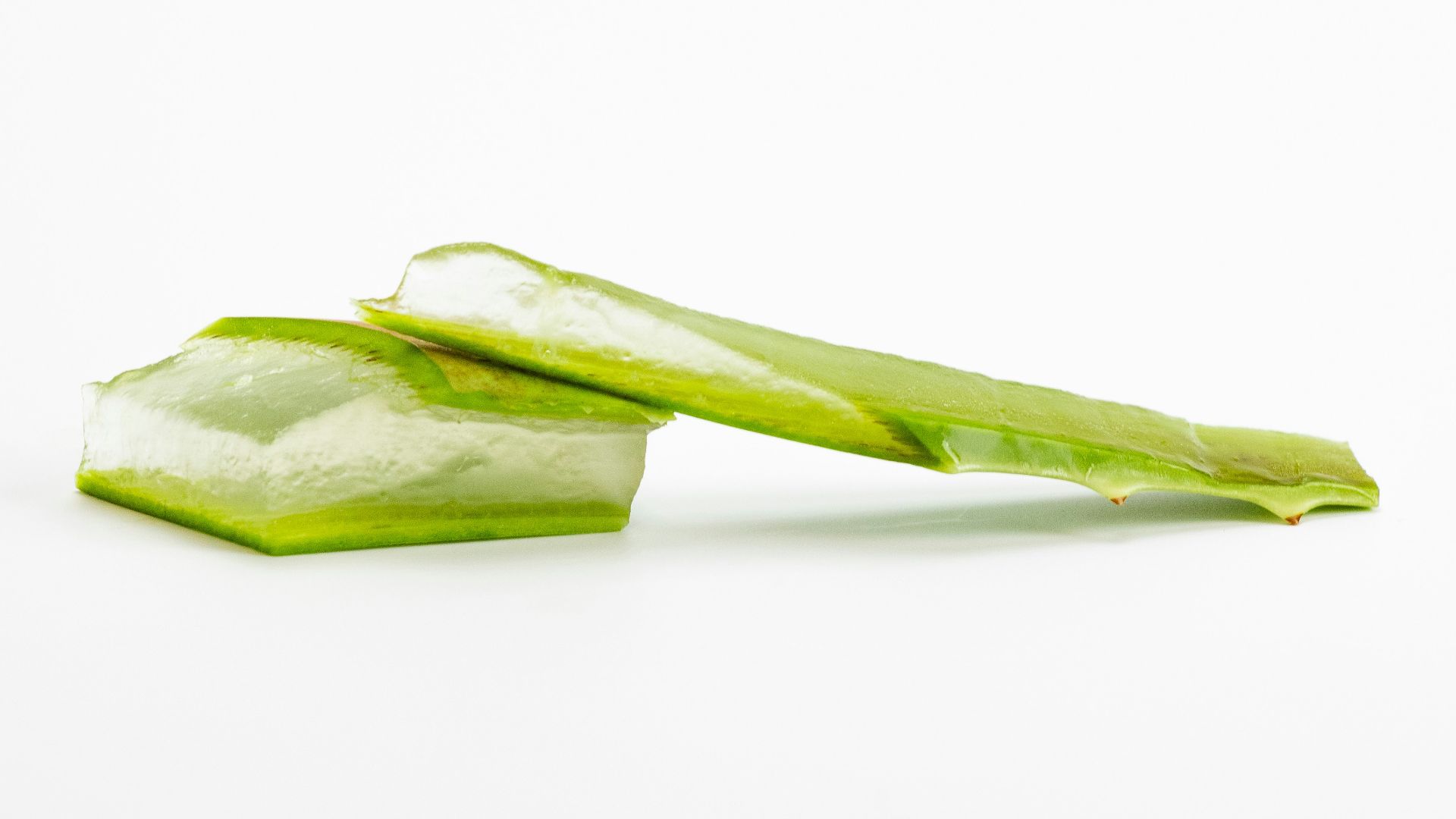 a piece of celery sitting on top of a white surface