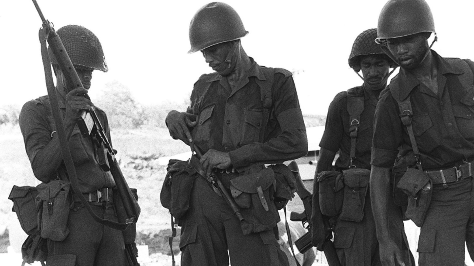 File:Members of the Eastern Caribbean Defense Force gathering weapons seized during Operation Urgent Fury 2.jpg