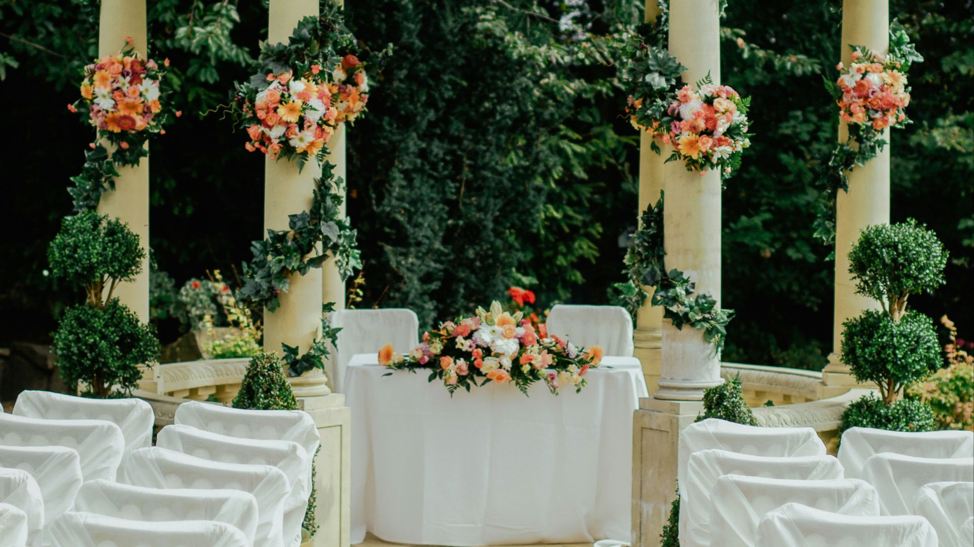 gray and beige gazebo near green leafed tree