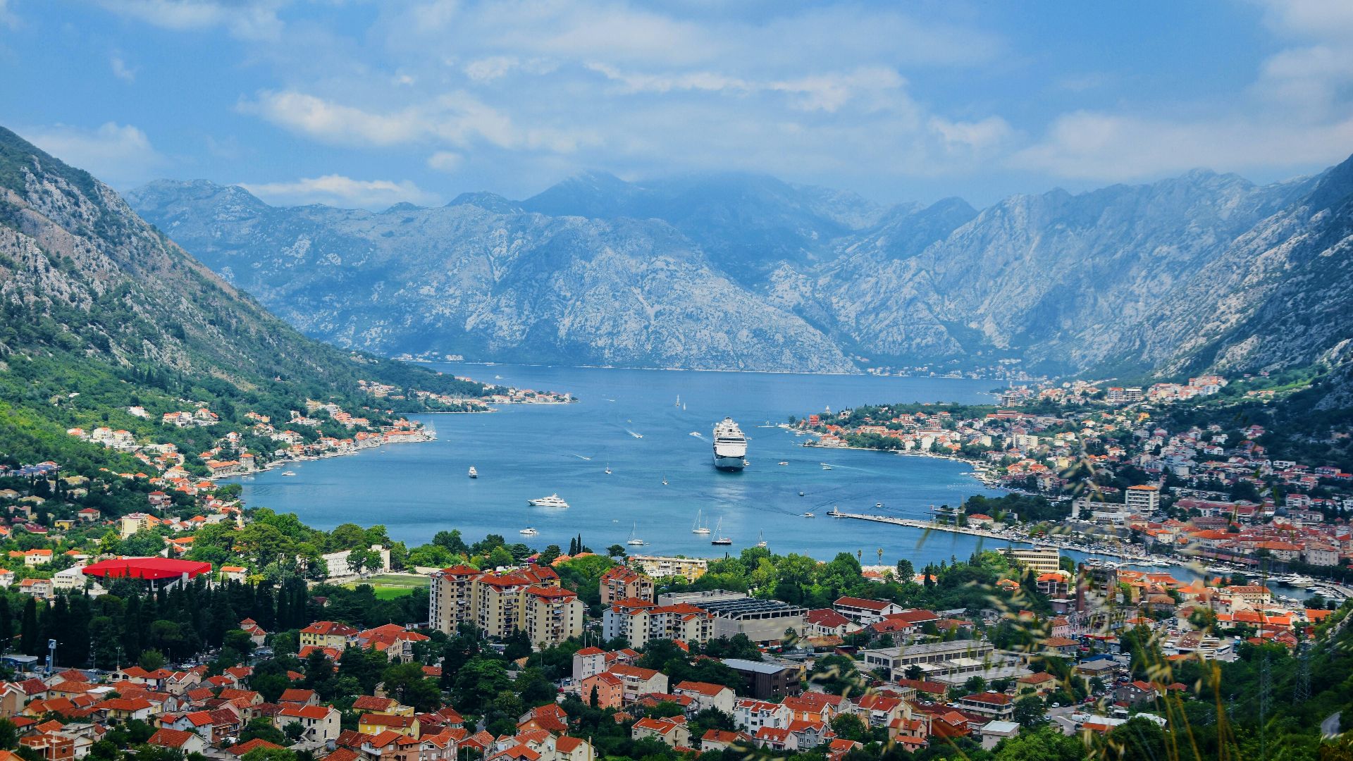 aerial view of city near body of water during daytime