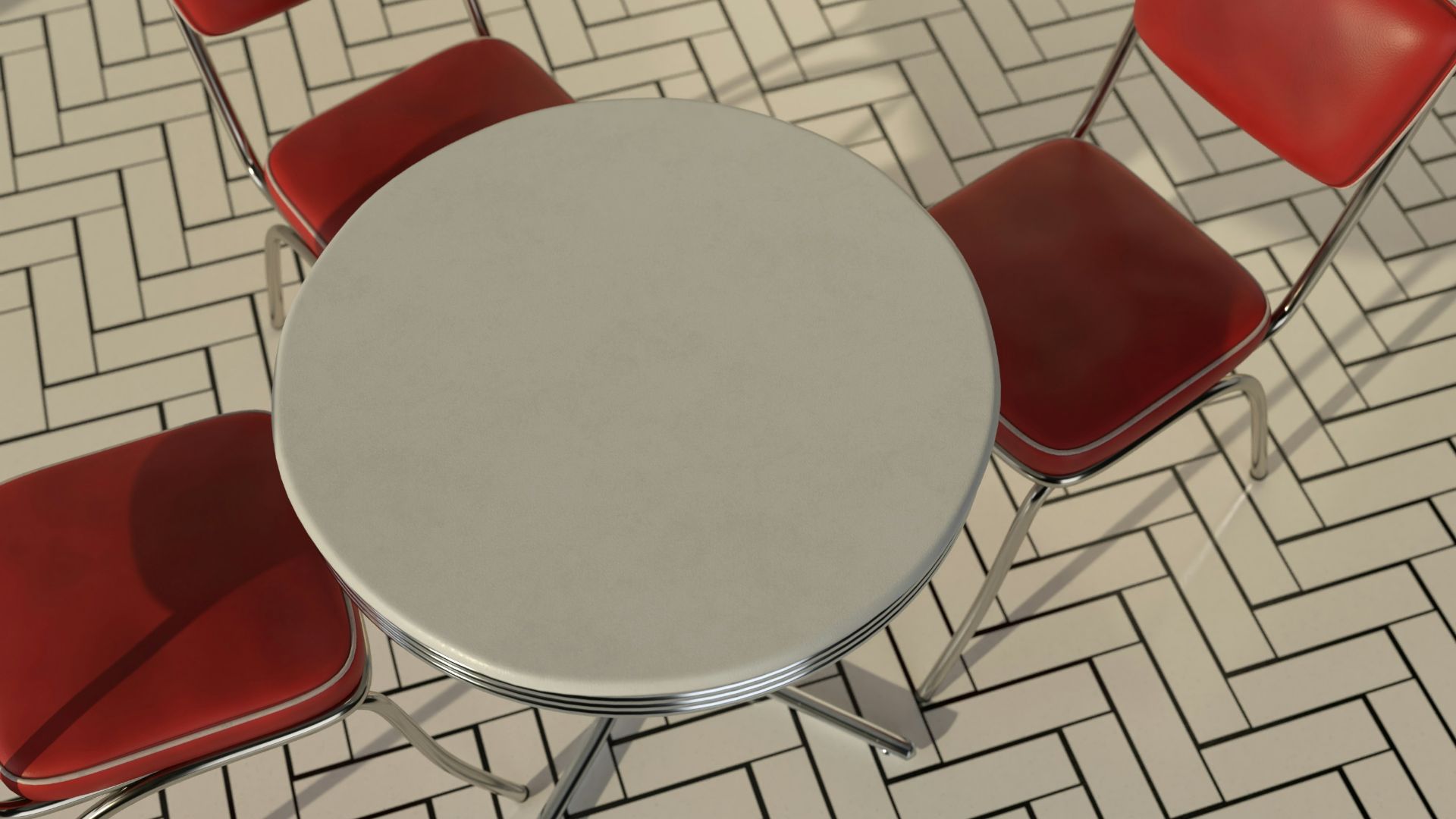 a round table with four red chairs around it