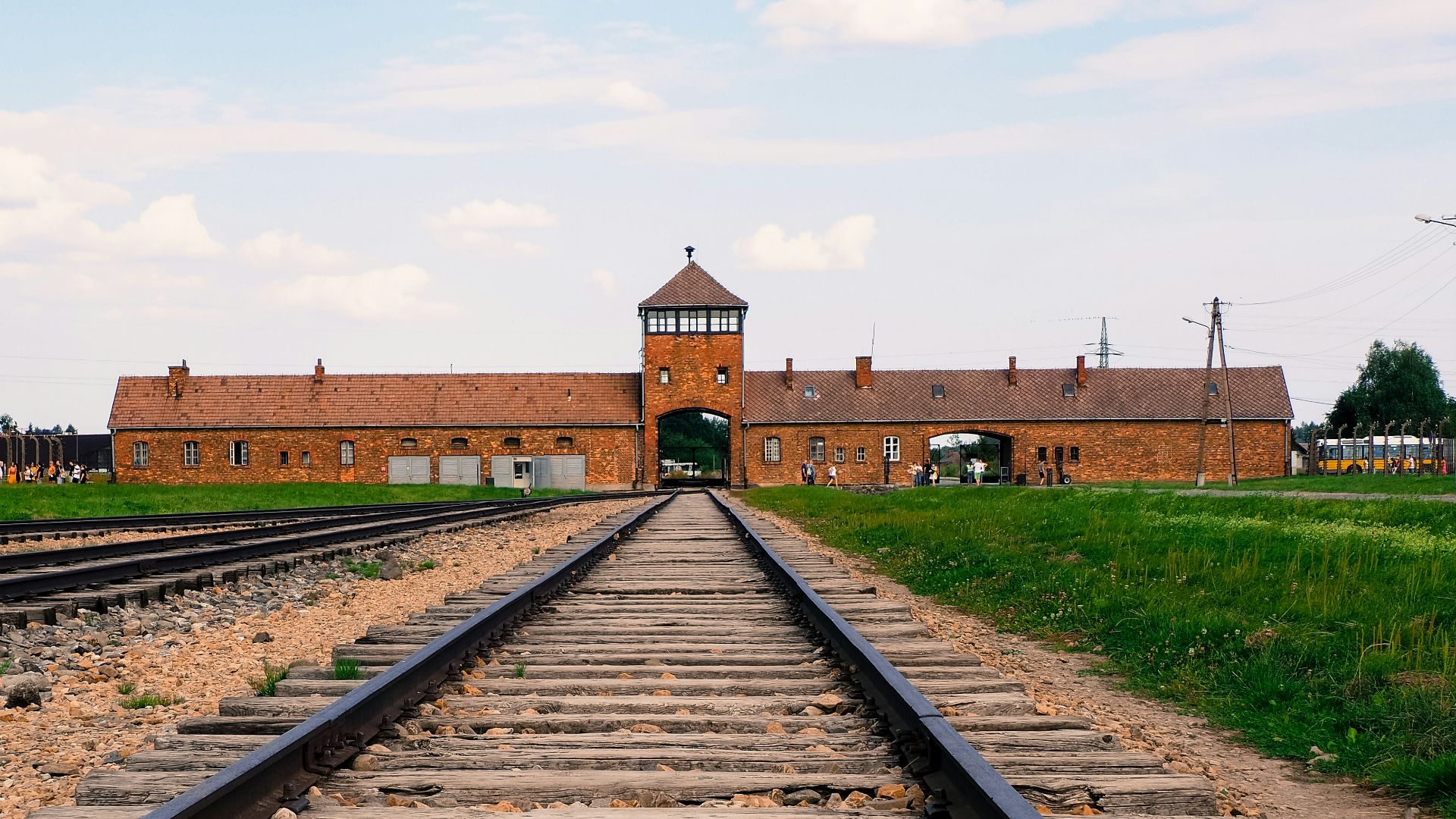 a train track with a building in the background