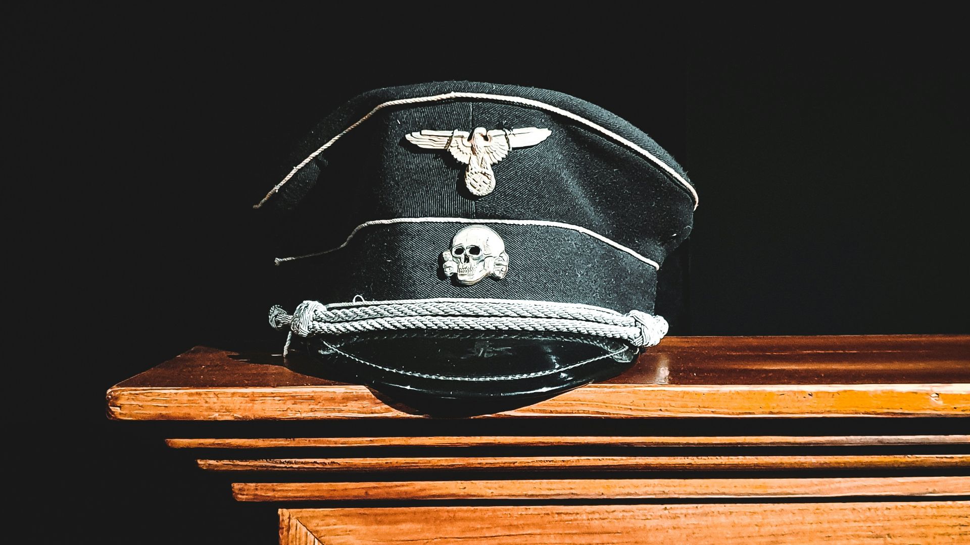 black and white helmet on brown wooden table