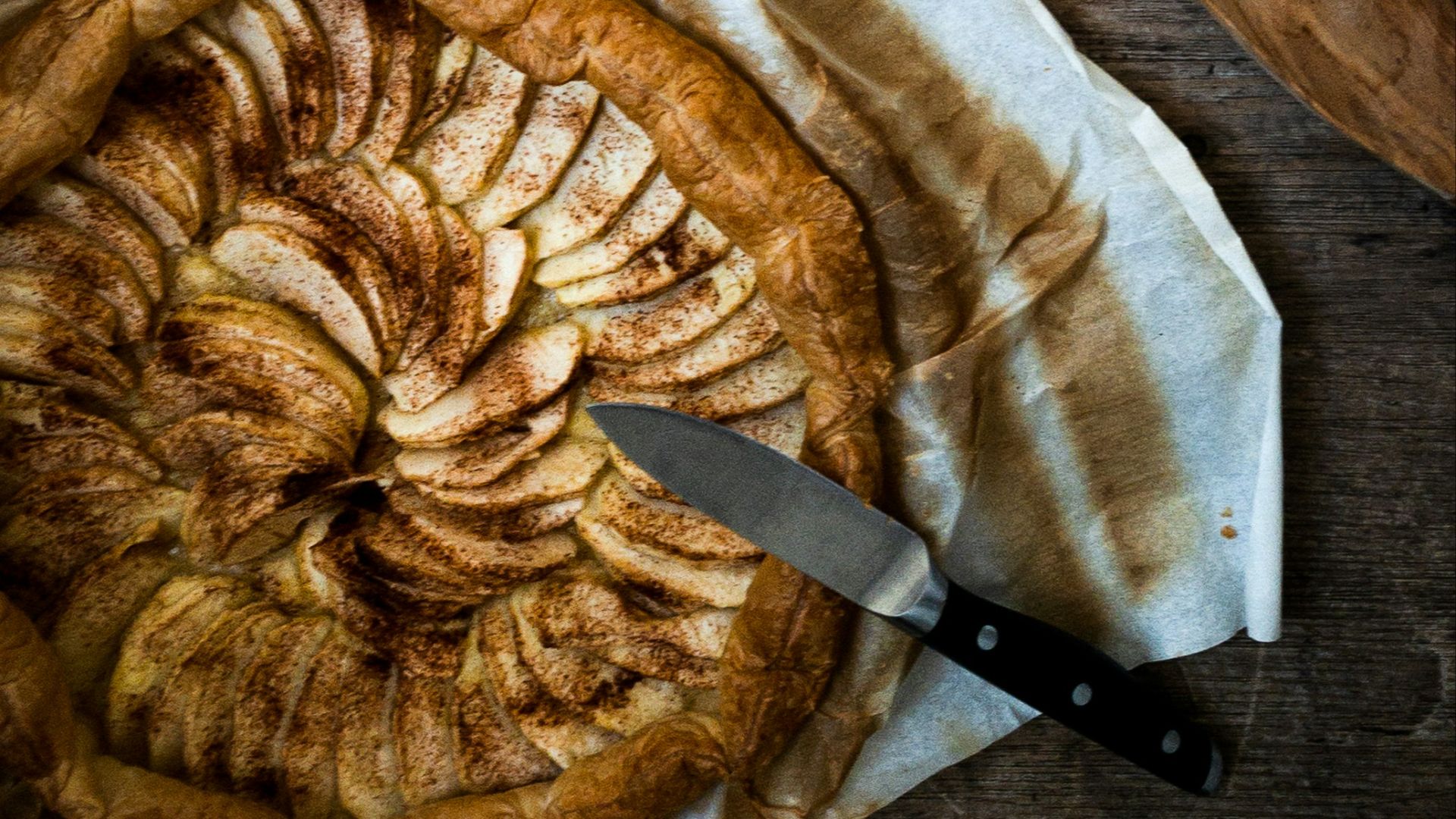 stainless steel mug with brown liquid on white textile