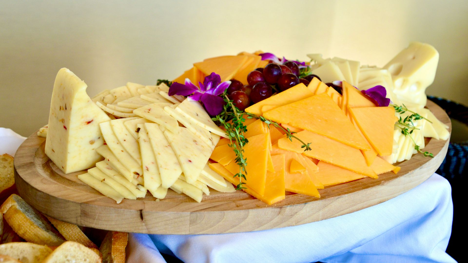sliced cheese on brown wooden chopping board